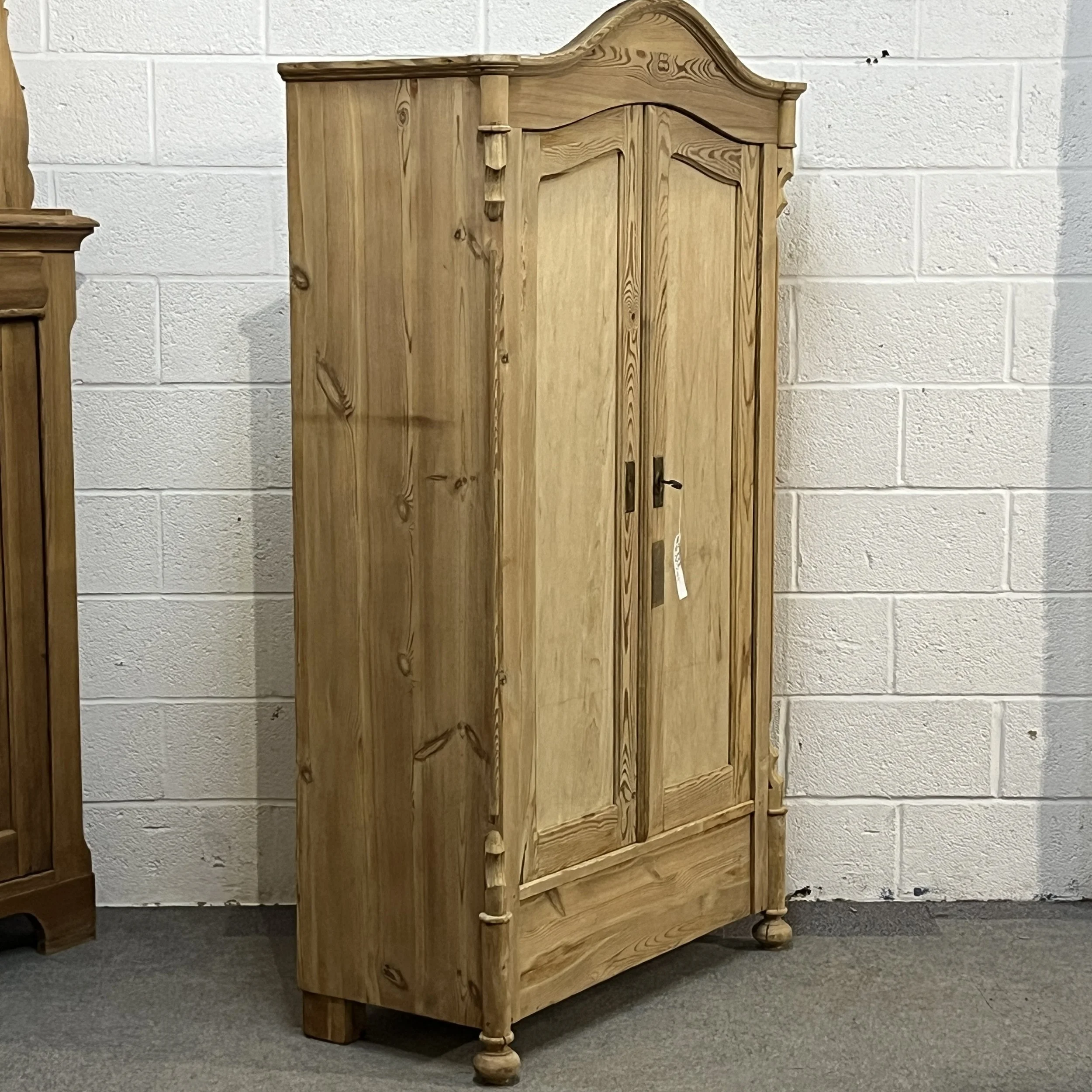Left-side angle of antique pine armoire N3304D
