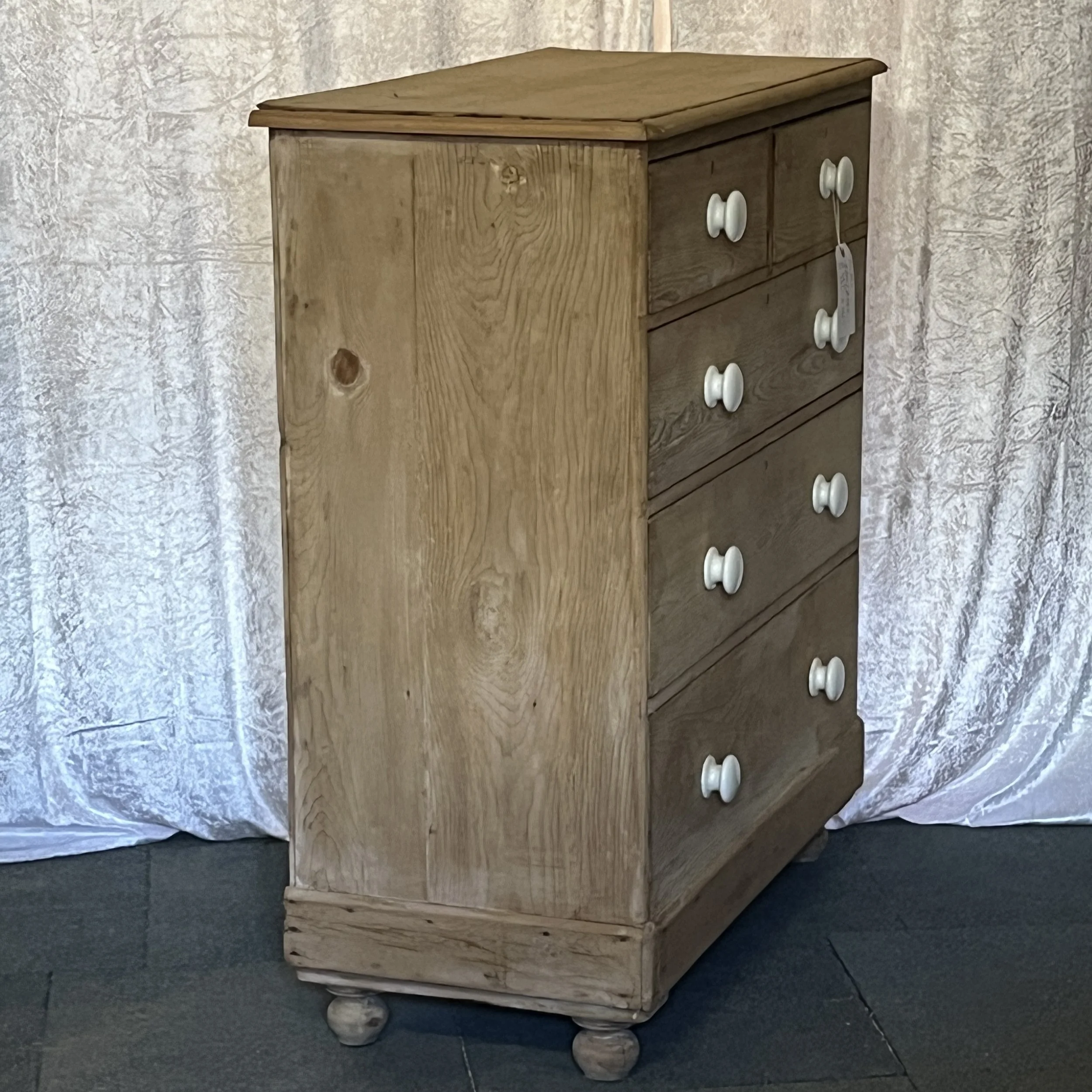 P0109B pine chest, left-side angle showing side panel, top and white ceramic knobs