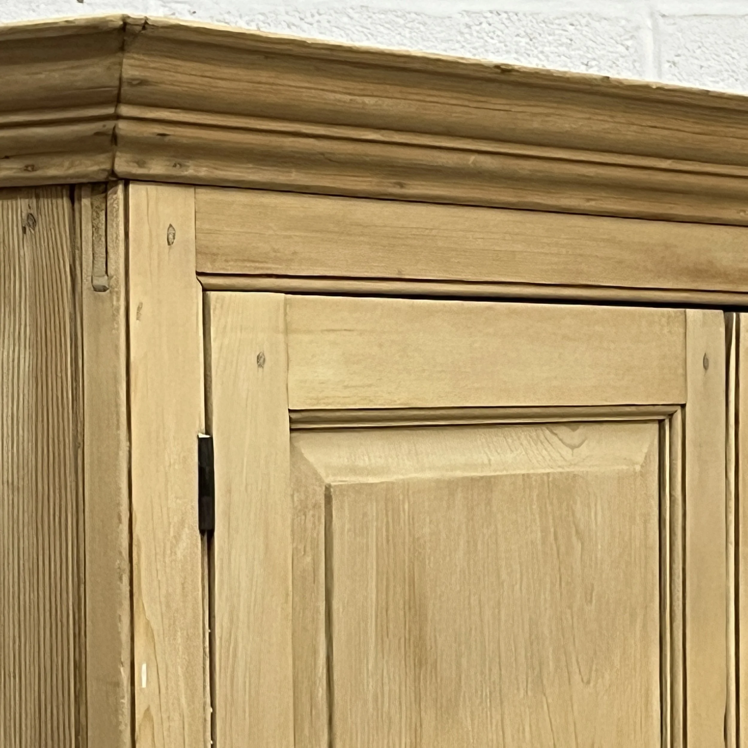 Detail of moulded cornice and upper cupboard door of linen press N3508H