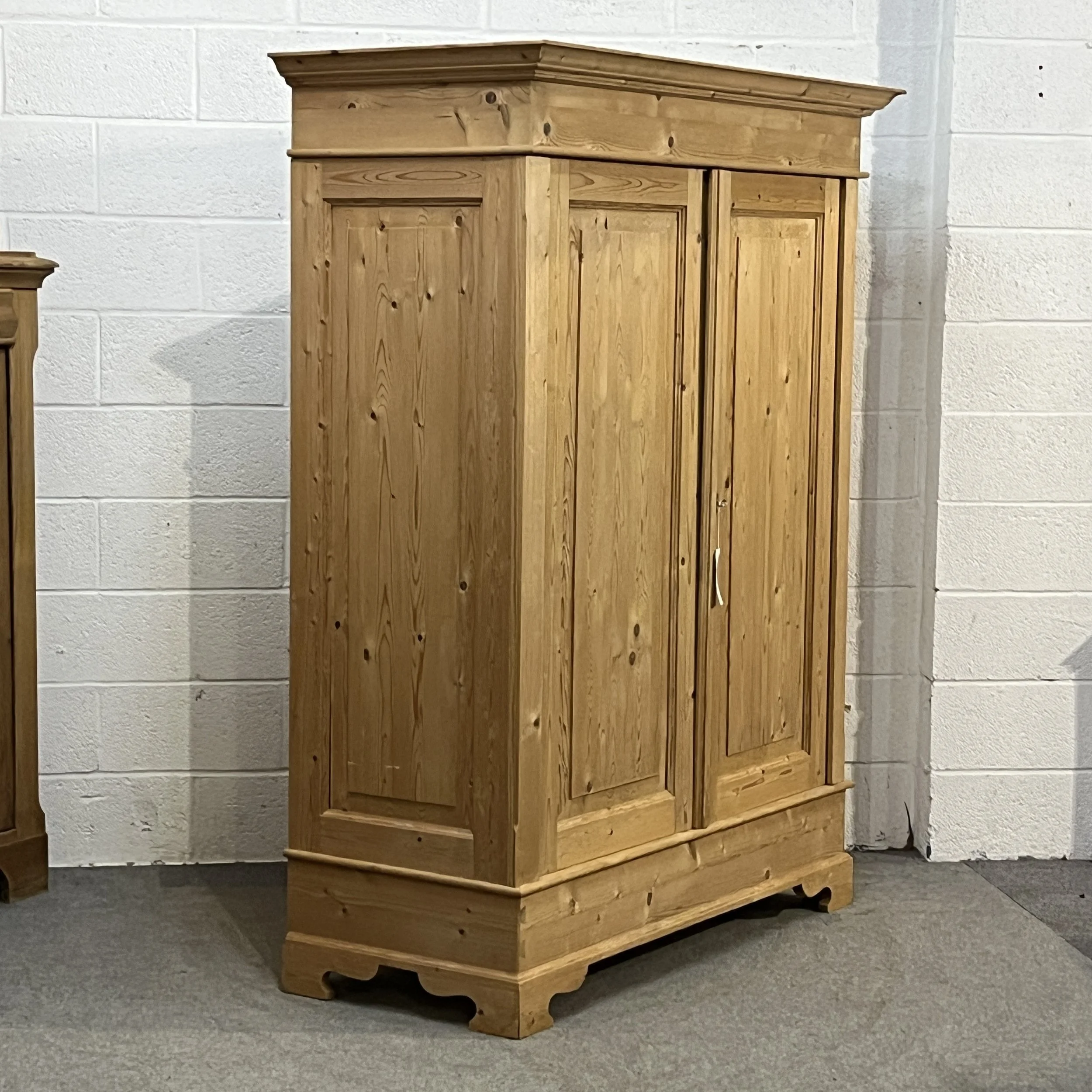 Opposite angled view of the double pine wardrobe showing its left side