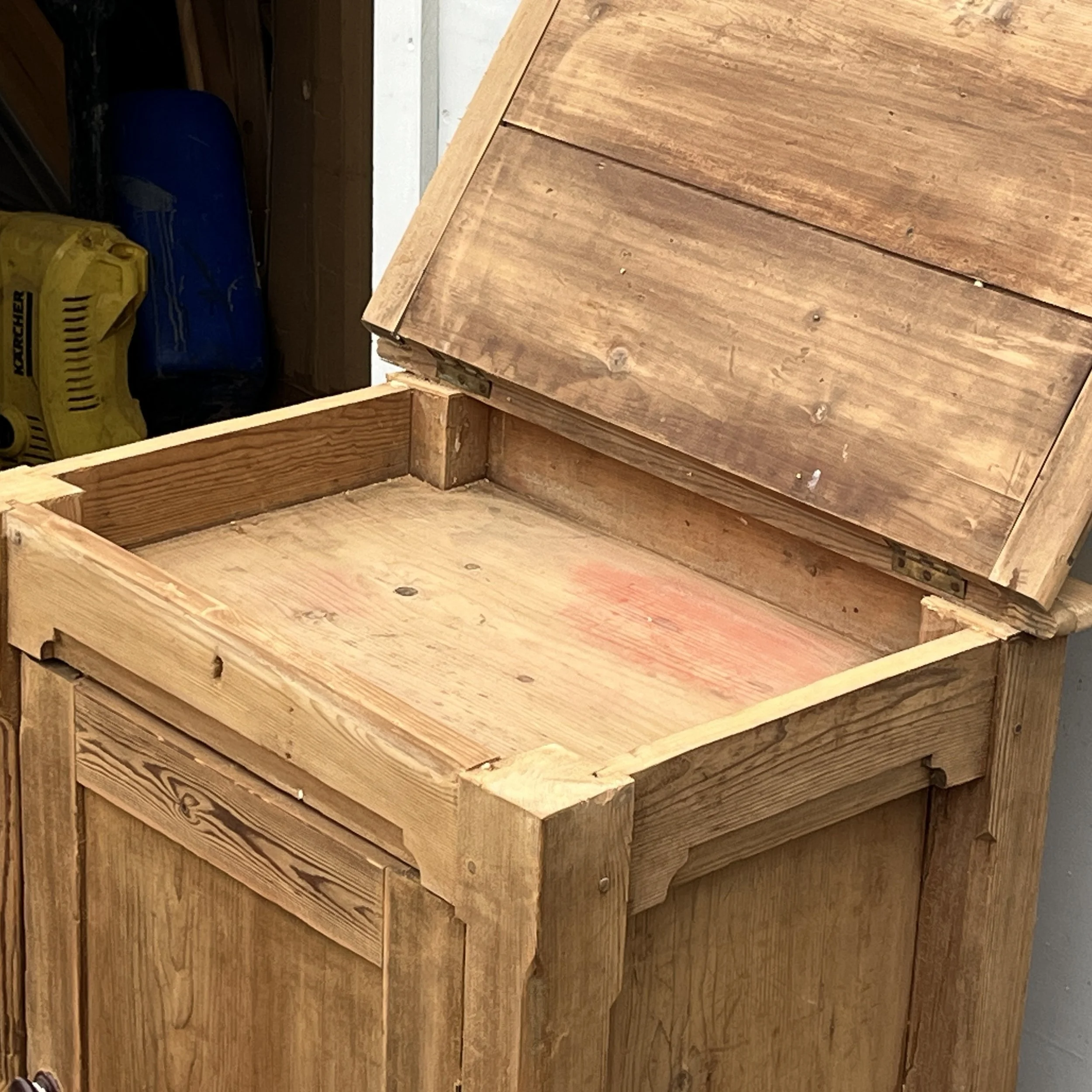 Detail of the open hinged top and shallow compartment of pine cupboard N8802C