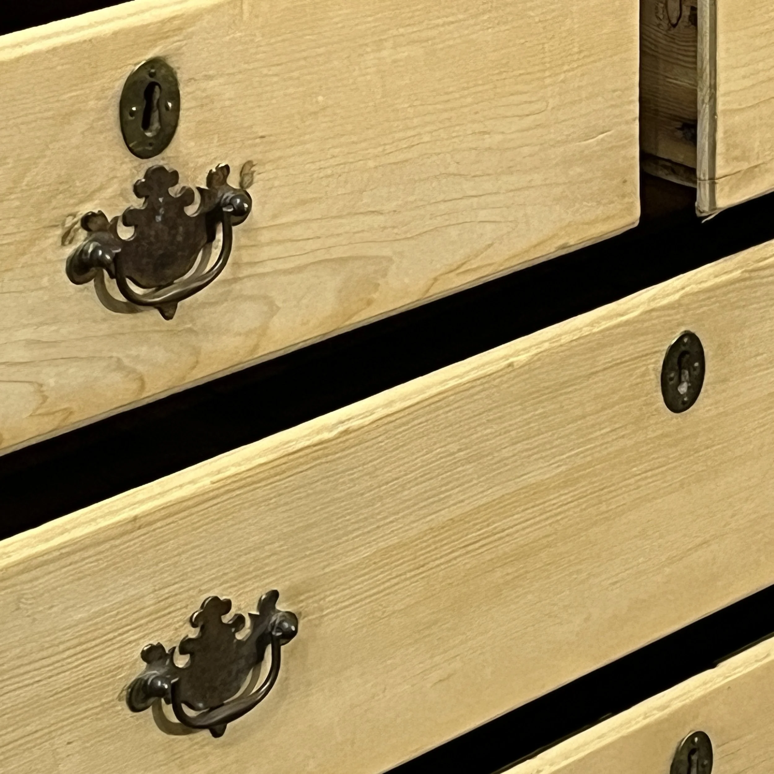 Close detail of drawer handles and open drawers on linen press N3508H
