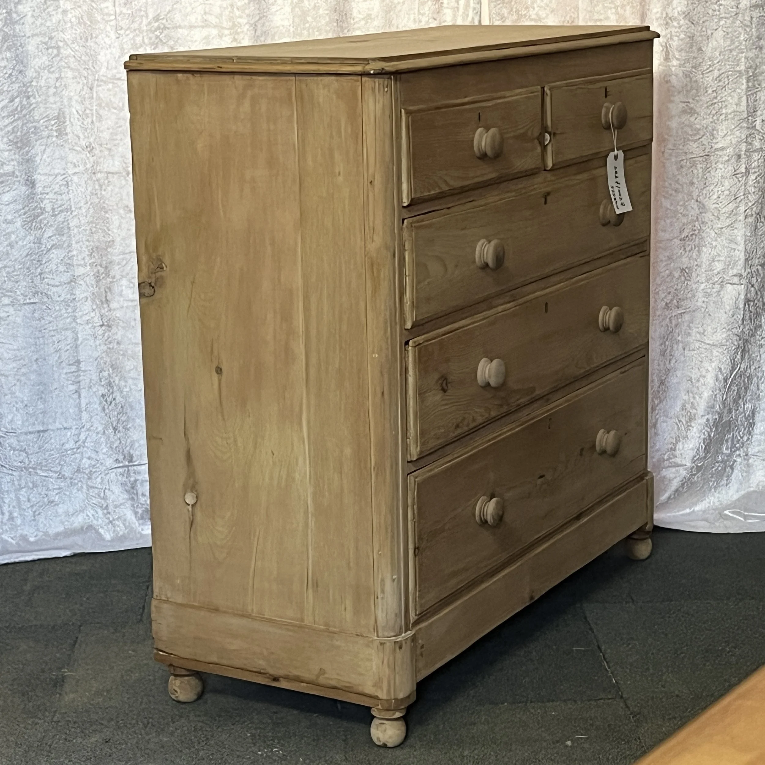 N4852E pine chest, left-side angle showing side panel, top and bun feet