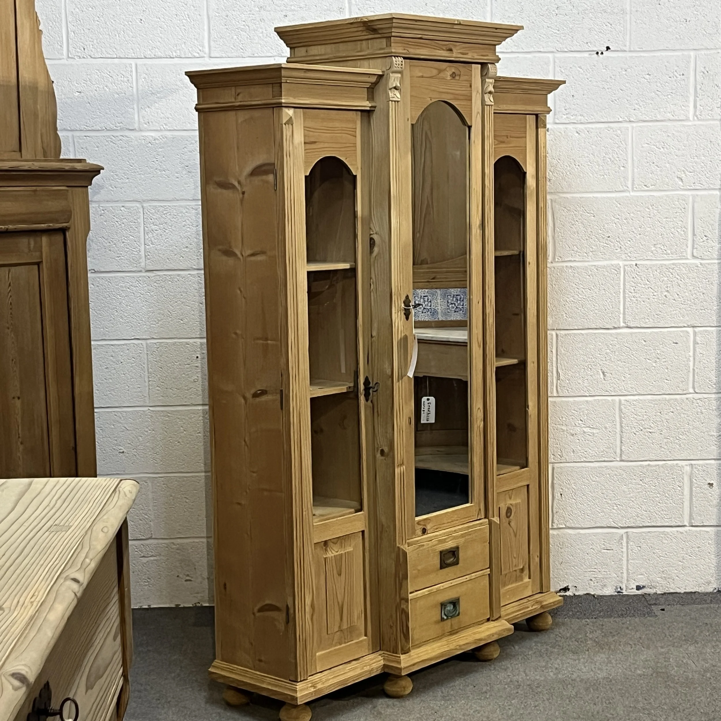 Left angled full view of reclaimed pine display cabinet N7500D with stepped cornices