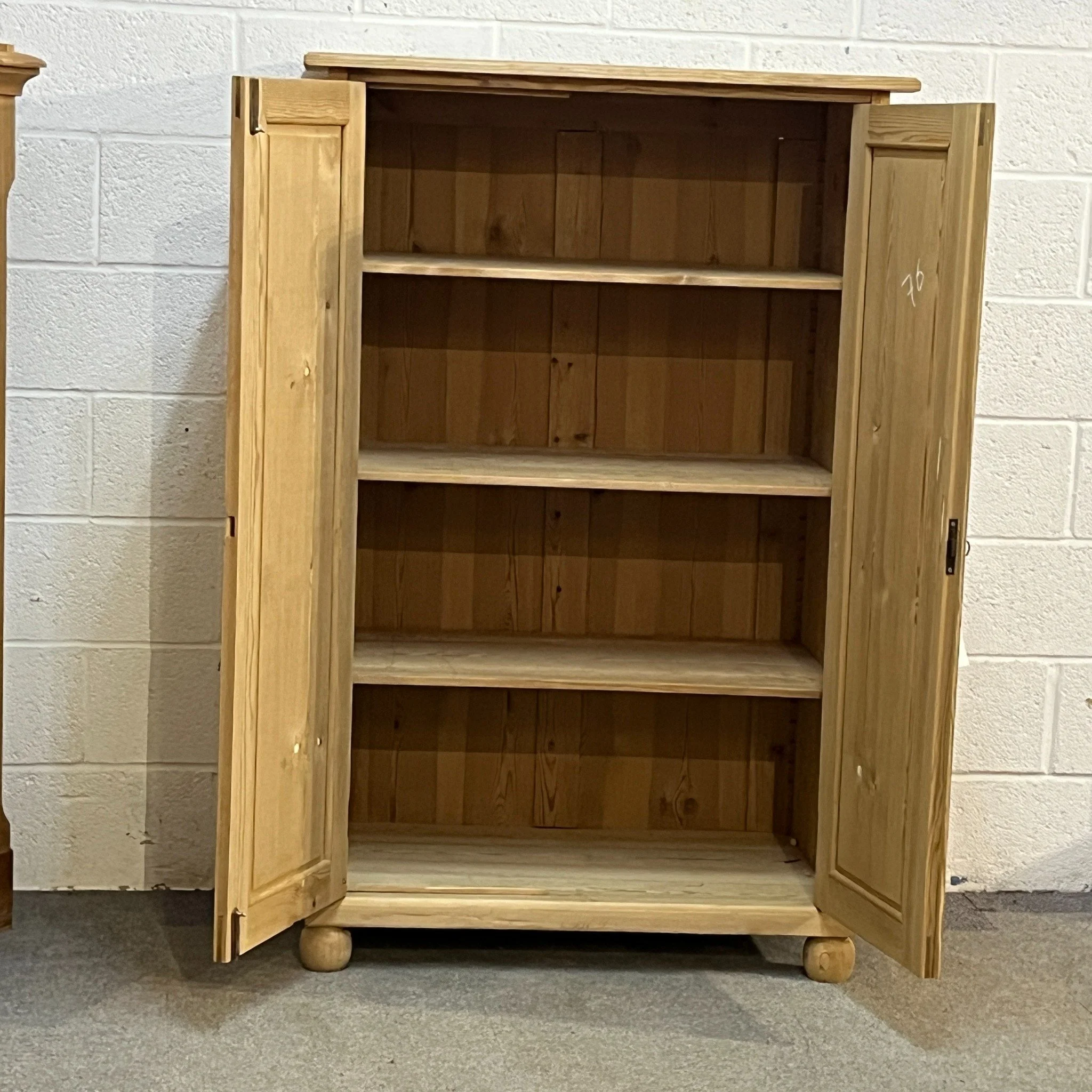 N7600D pine cupboard — both doors open showing three adjustable shelves