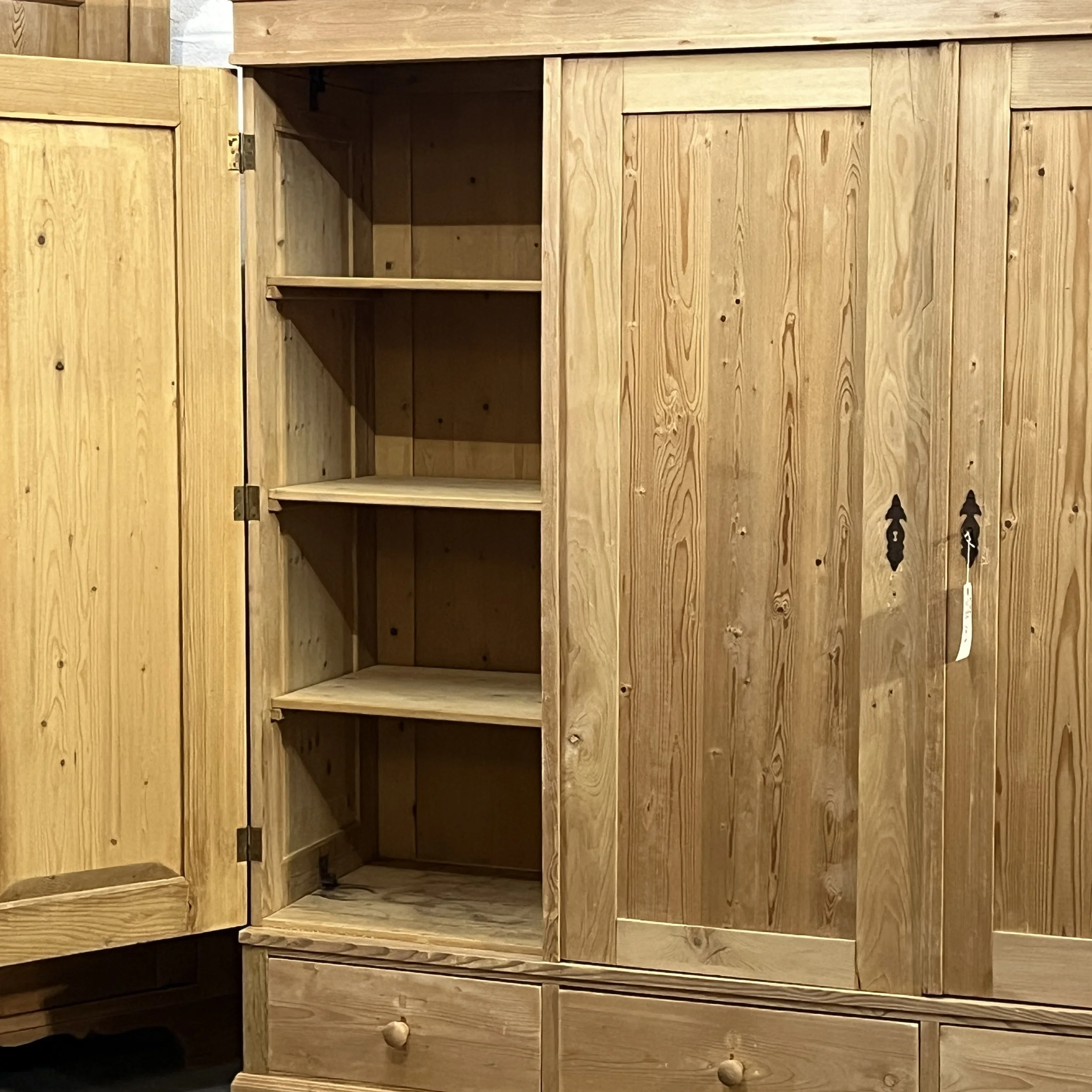 Close view of the pine wardrobe shelved left compartment