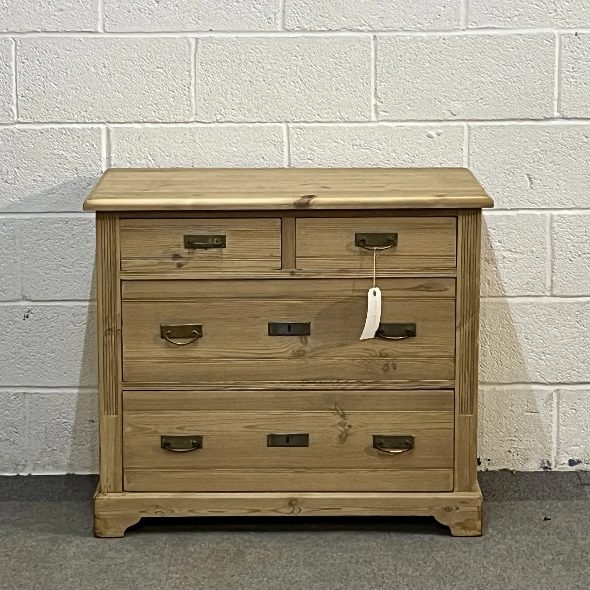 Small 1930s pine chest of drawers N8004C, straight-on front showing two small drawers above two full-width drawers.