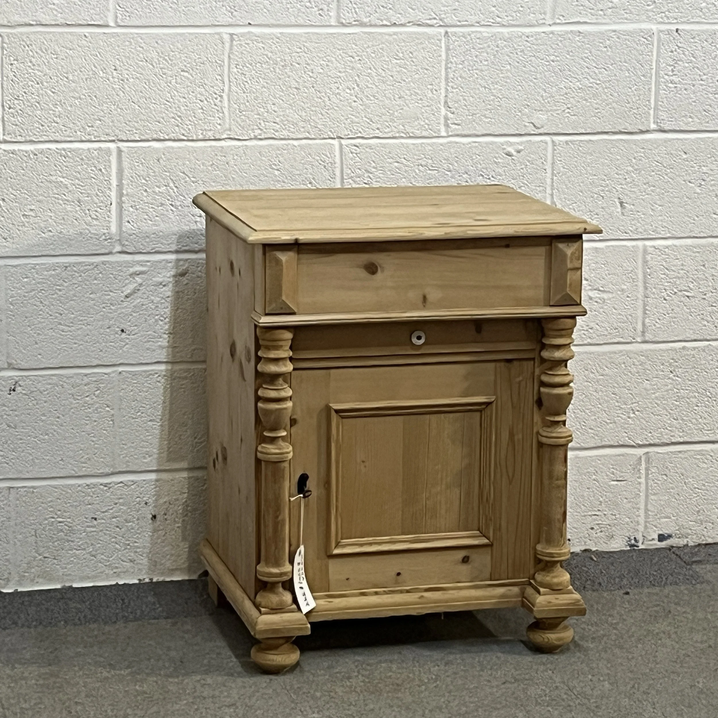 Closer front view of the small antique pine wash cupboard