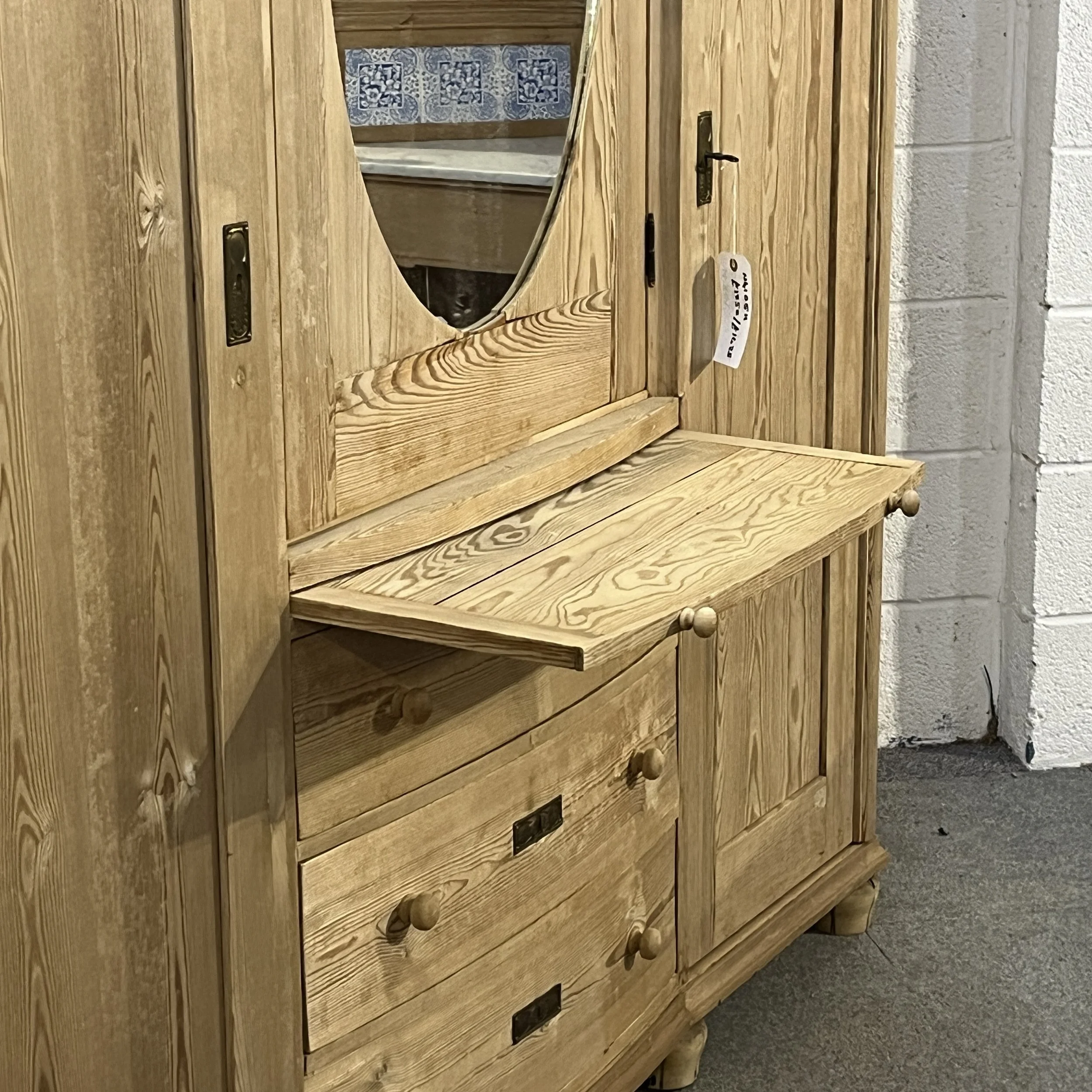 N4105H wardrobe with pull-out vanity surface extended below the oval mirror