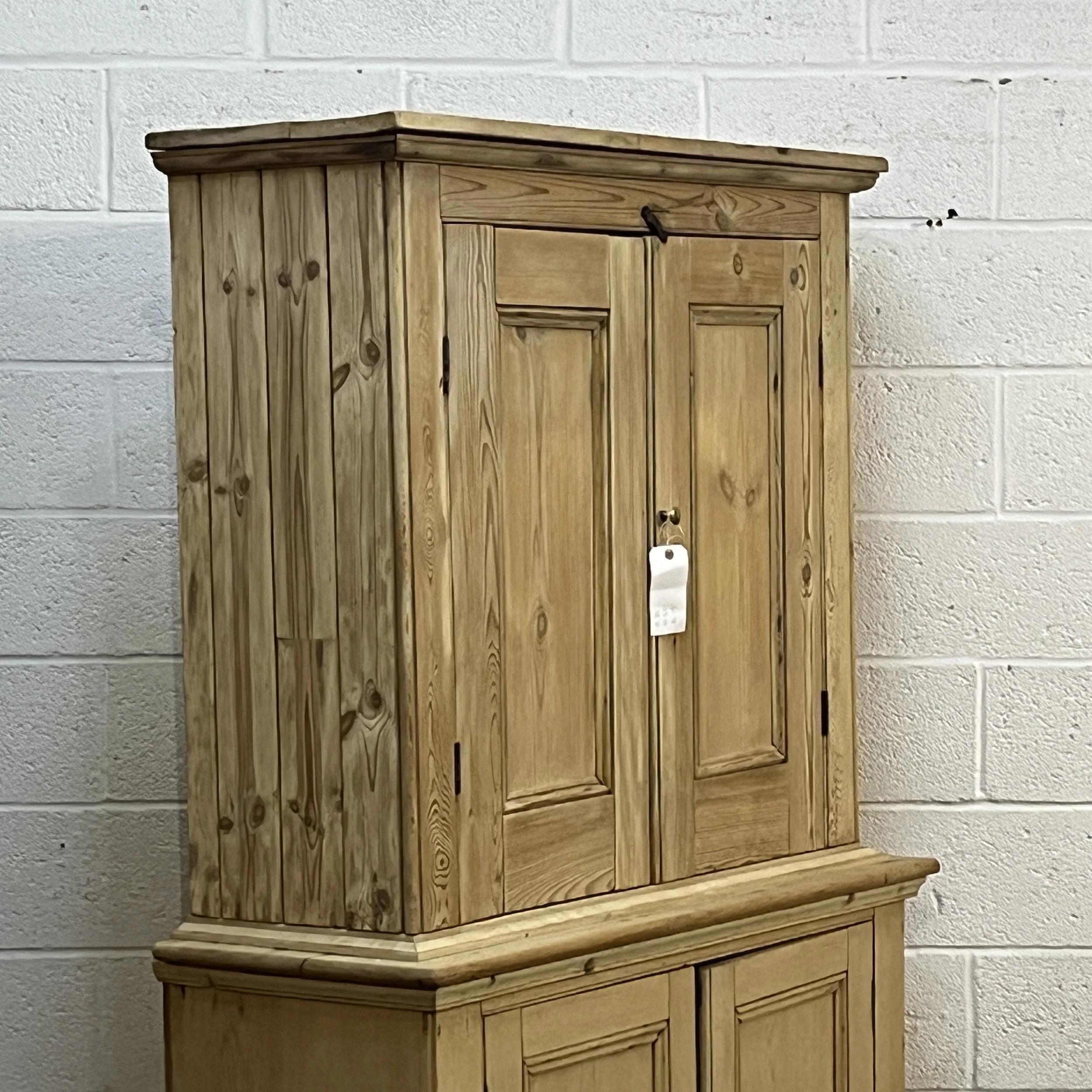 Large old pine cupboard N7809E upper section angled detail with boarded side and panelled doors
