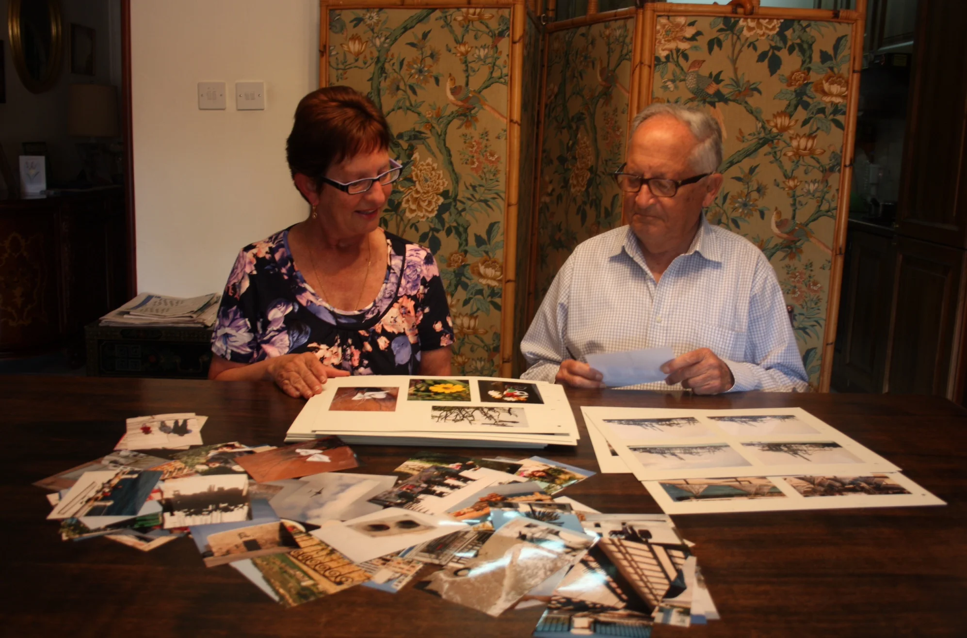 Rita helping Mr.Rizzo catalogue his collection of photos