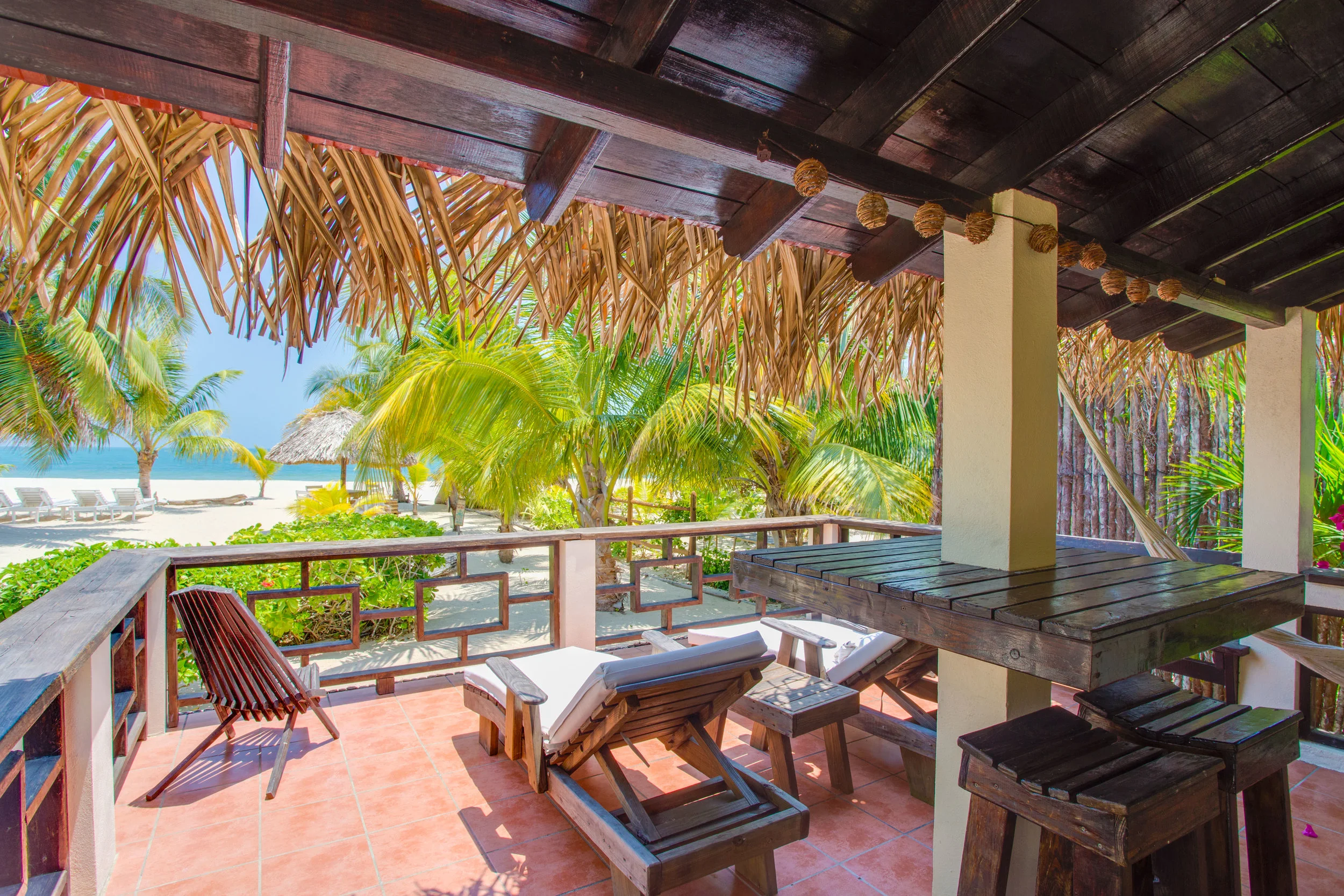 Our extra large verandas seat 8+ - they provide multiple seating options so you can enjoy every activity on your private veranda - cushioned loungers, barstools, bench, clam chairs, and hammock - this is one of many stunning views off Sol veranda