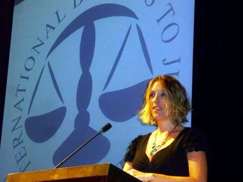 Giving a speech at a Gala dinner in Singapore on behalf of International Bridges to Justice, the NGO Stauffer managed in Singapore