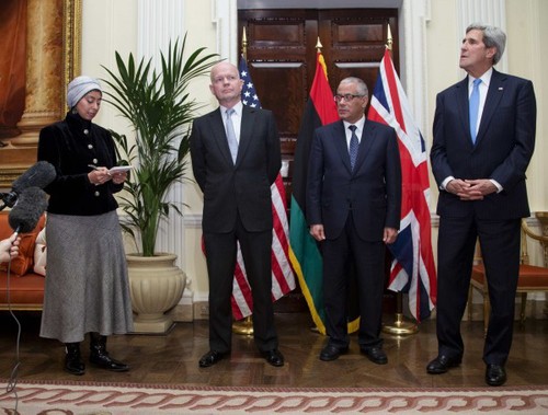 Maha interpreting consecutively during a press conference with former UK Foreign Secretary William Hague, former Libyan PM Ali Zeidan and US Secretary of State John Kerry