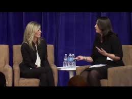 Conducting an interview on a panel at Futures Without Violence Open Square Summit