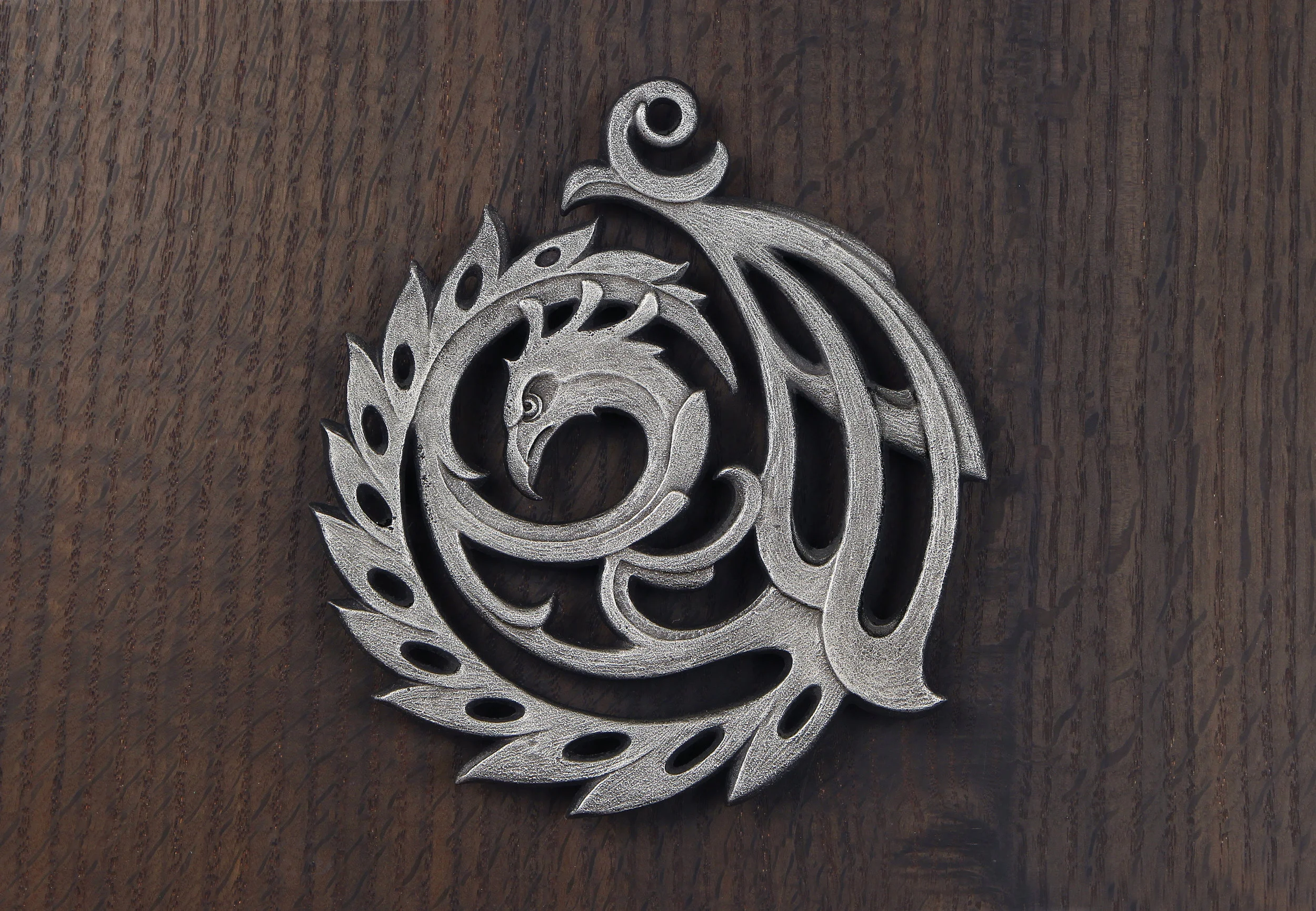 SQ_Phoenix Trivet 2011- silver on grey oak 1.jpg