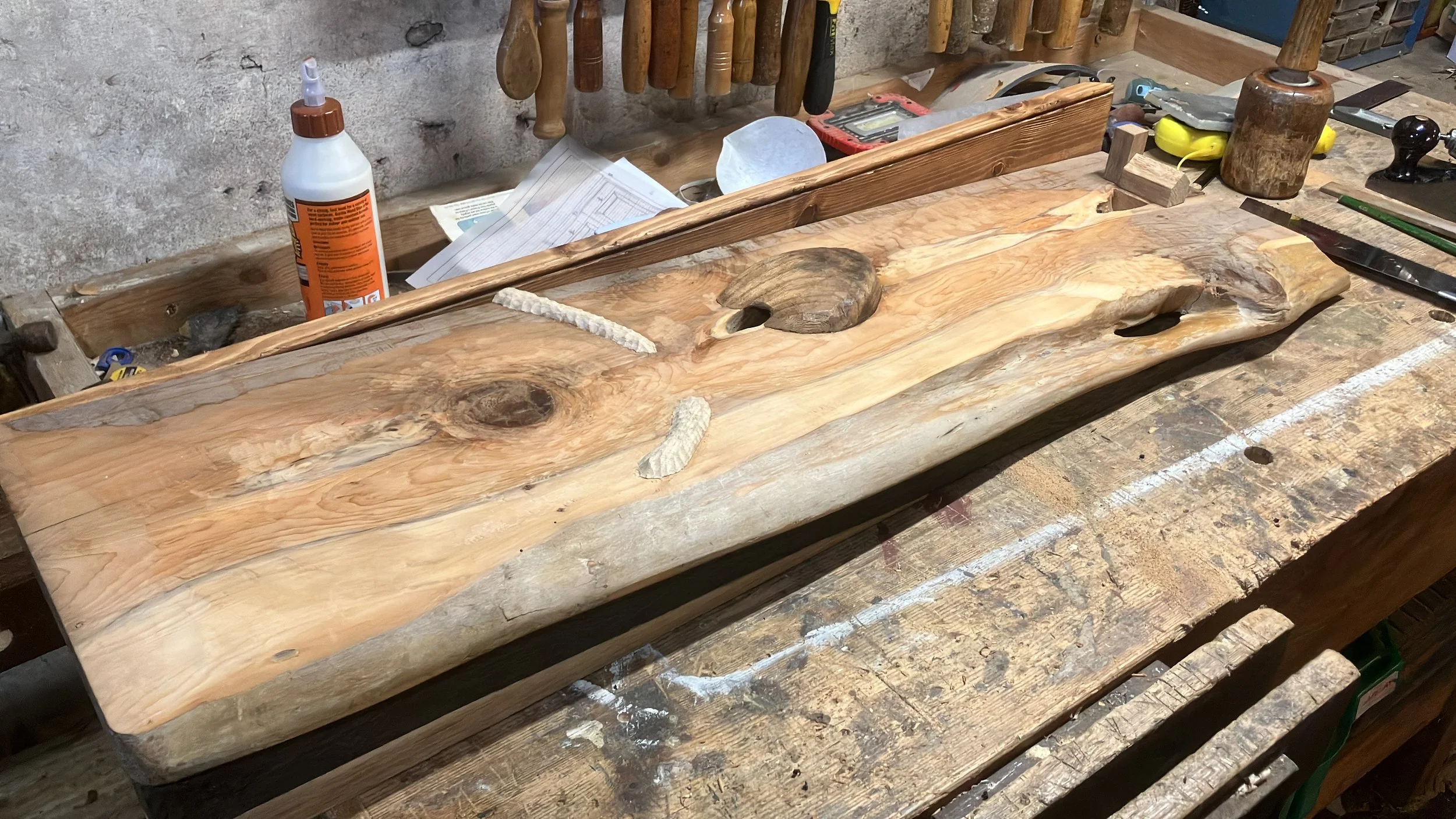 Holes for coins to roll into