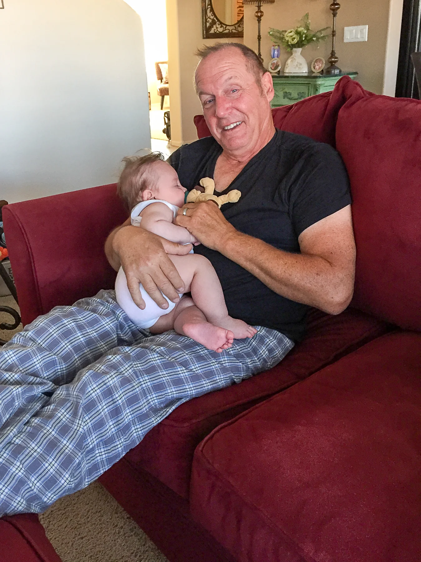 Taking a nap on Poppa's lap.