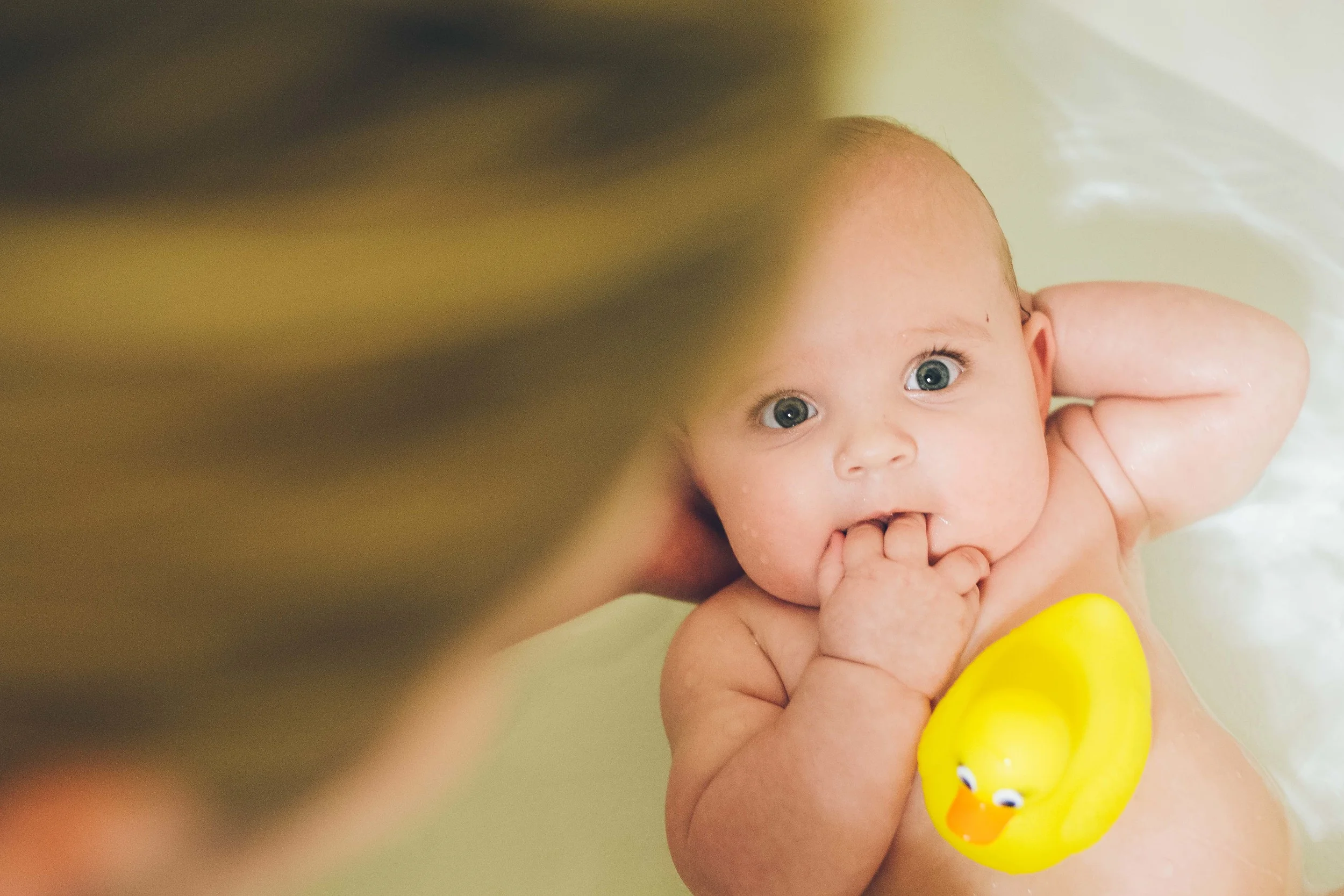 Lydia loves to play with her new rubber ducky. 