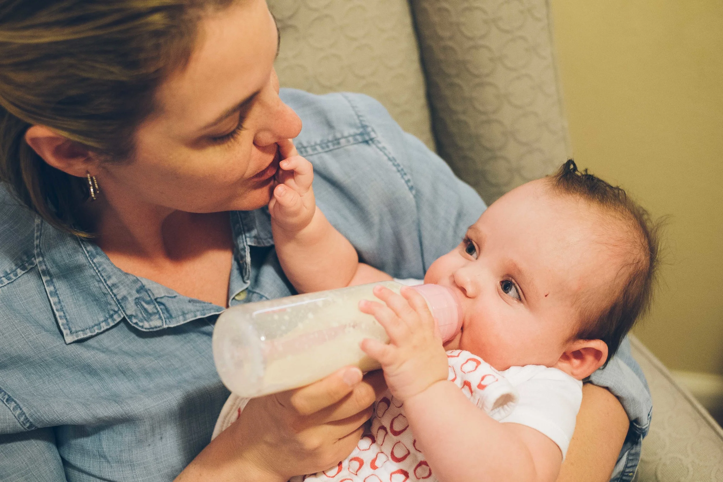 Lydia also likes to help hold her bottle.
