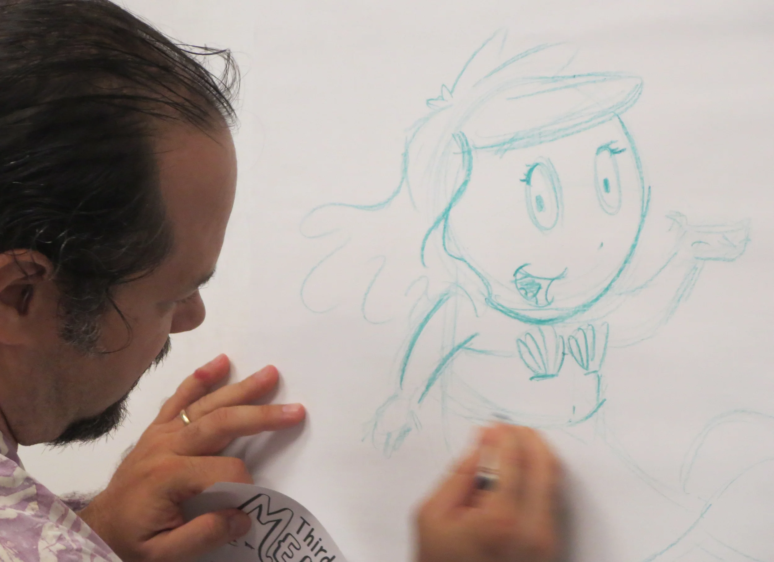 Me drawing Cora with a crayon.