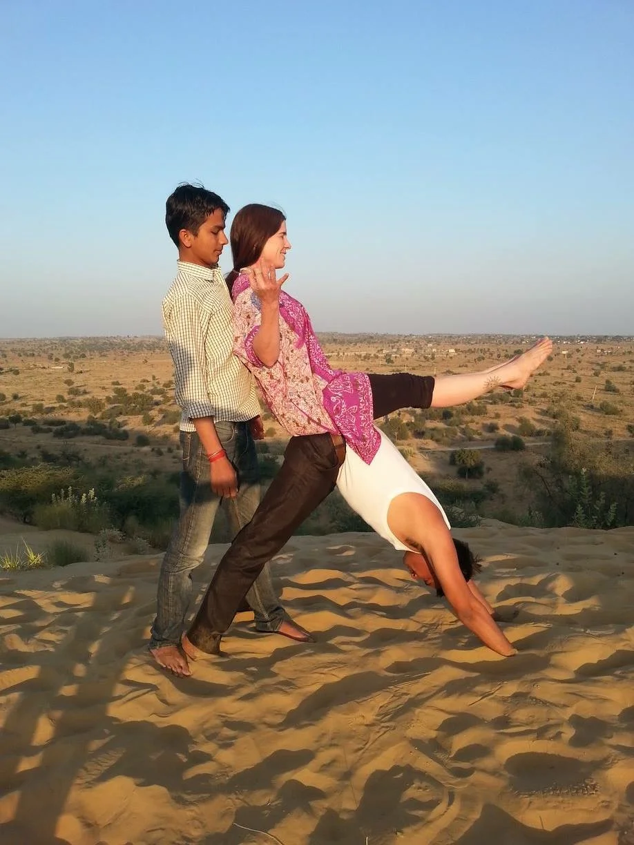 Boat pose is easier with a little help from behind.
