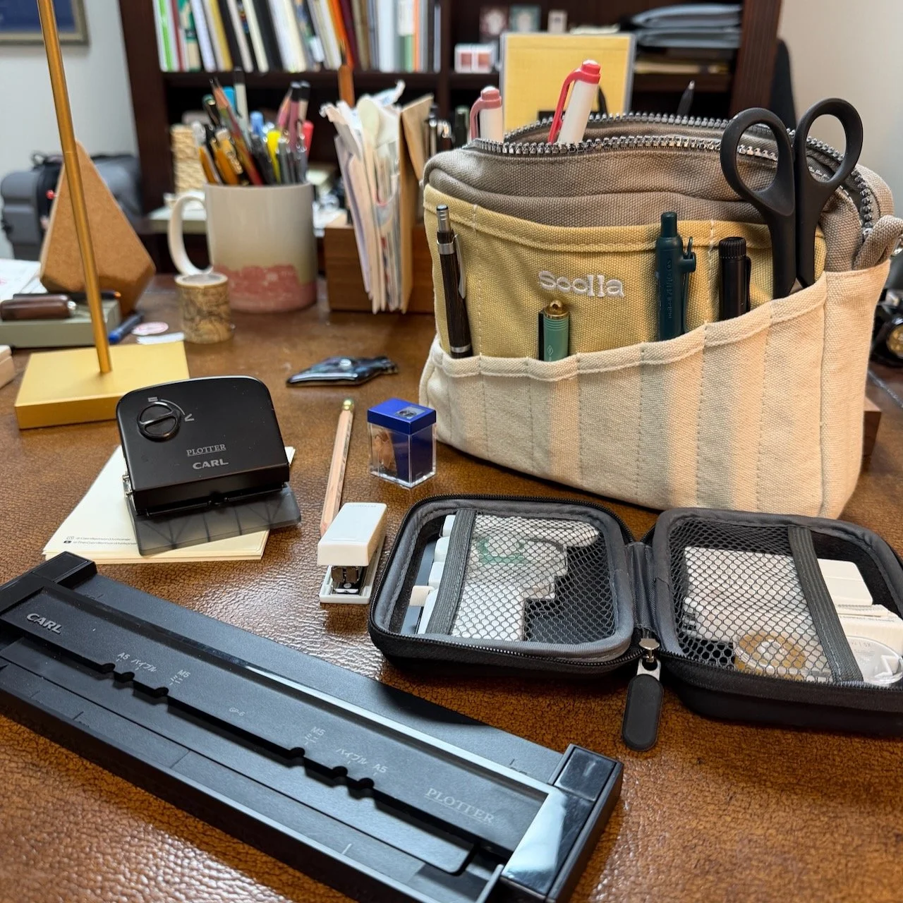 Soolla Pouch on Desk with Joe's Top 5 Stationery Items laid out on the desk
