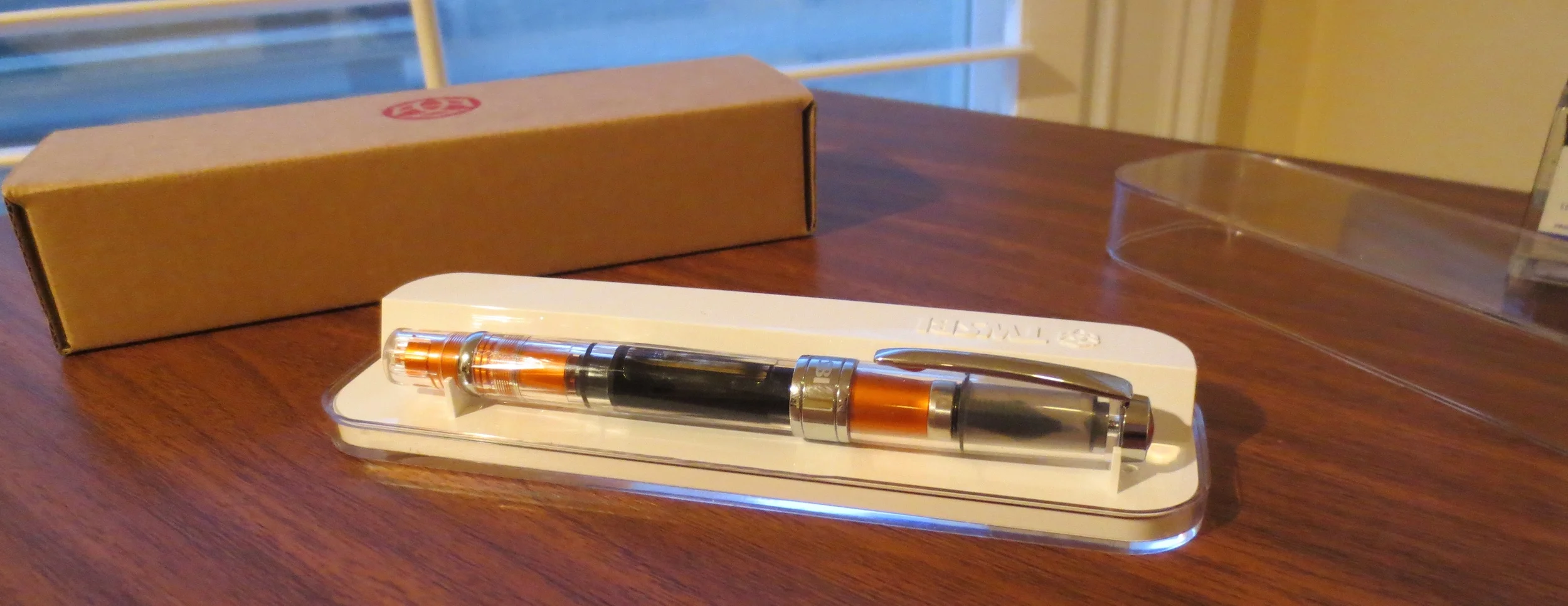 My TWSBI in its apple-esque white plastic packaging. I save my TWSBI boxes for pen storage. 