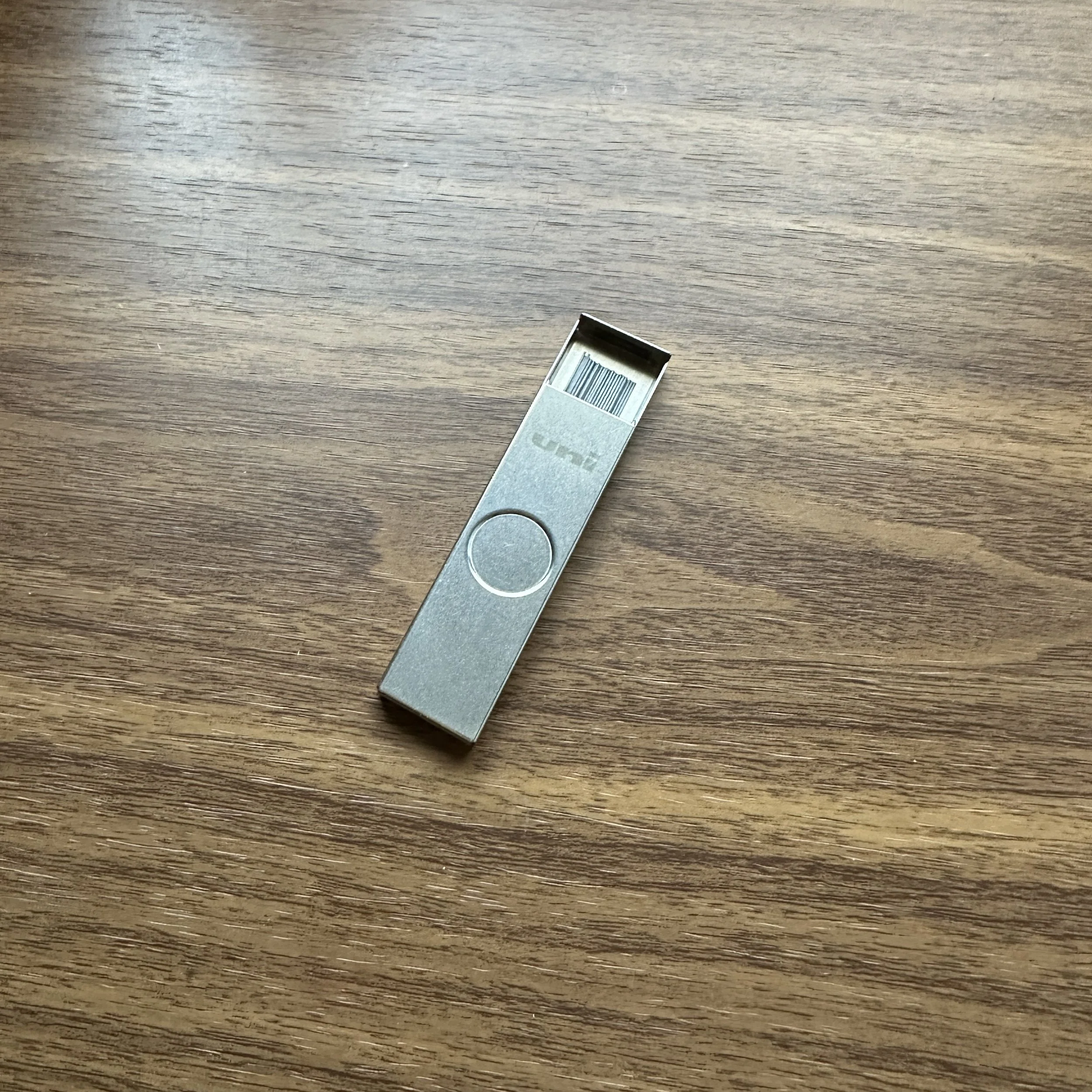 Uni Metal Mechanical Pencil Lead Case (Open on Table)
