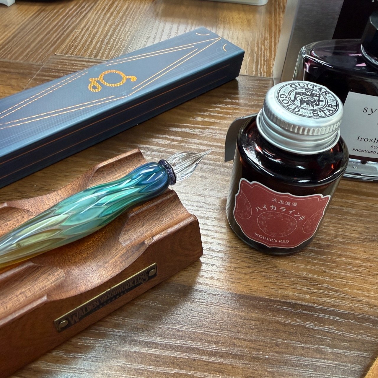 Glass Pen on Desk with Teranishi Modern Red Fountain Pen Ink