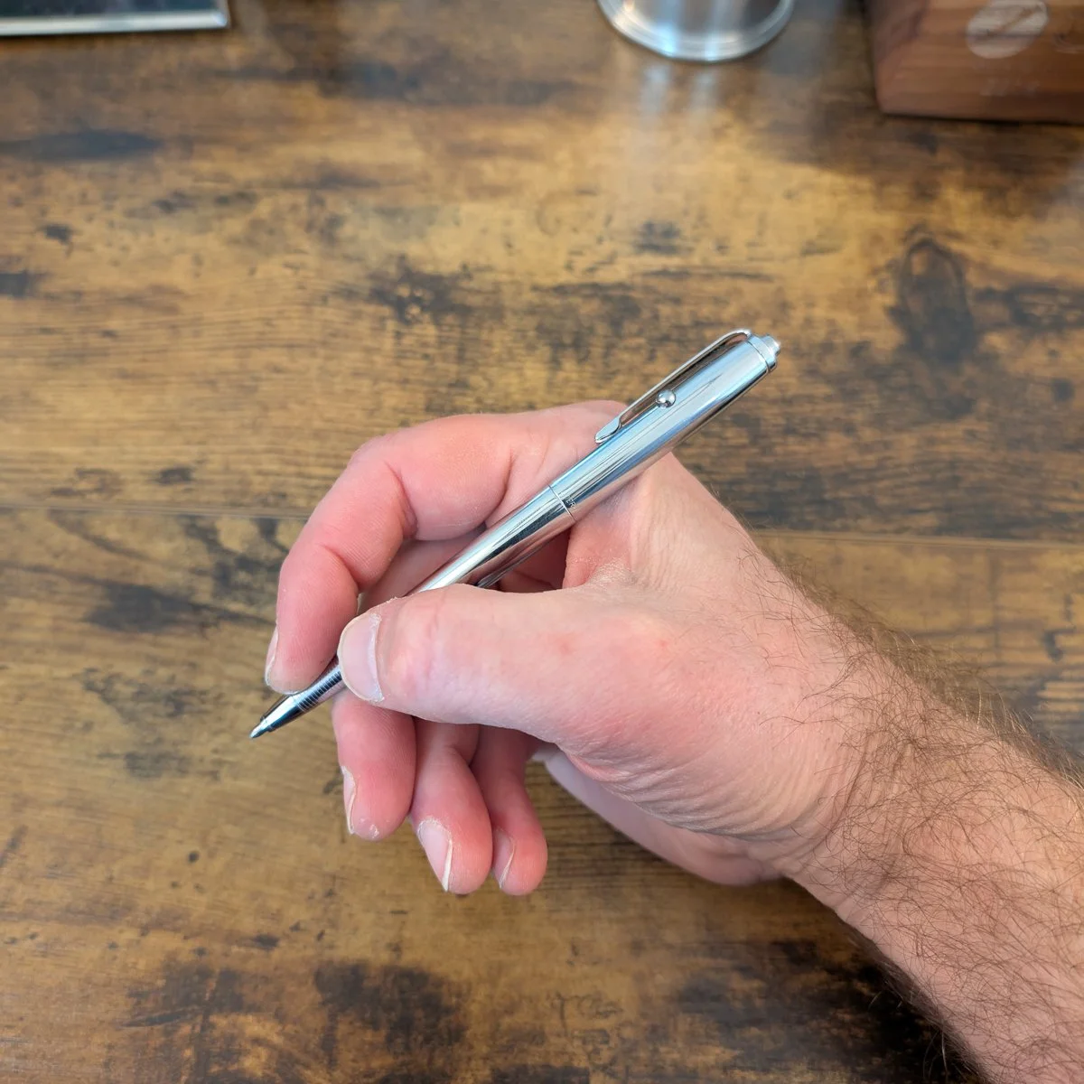 Fisher Space Pen AG7 Stainless Steel in Hand