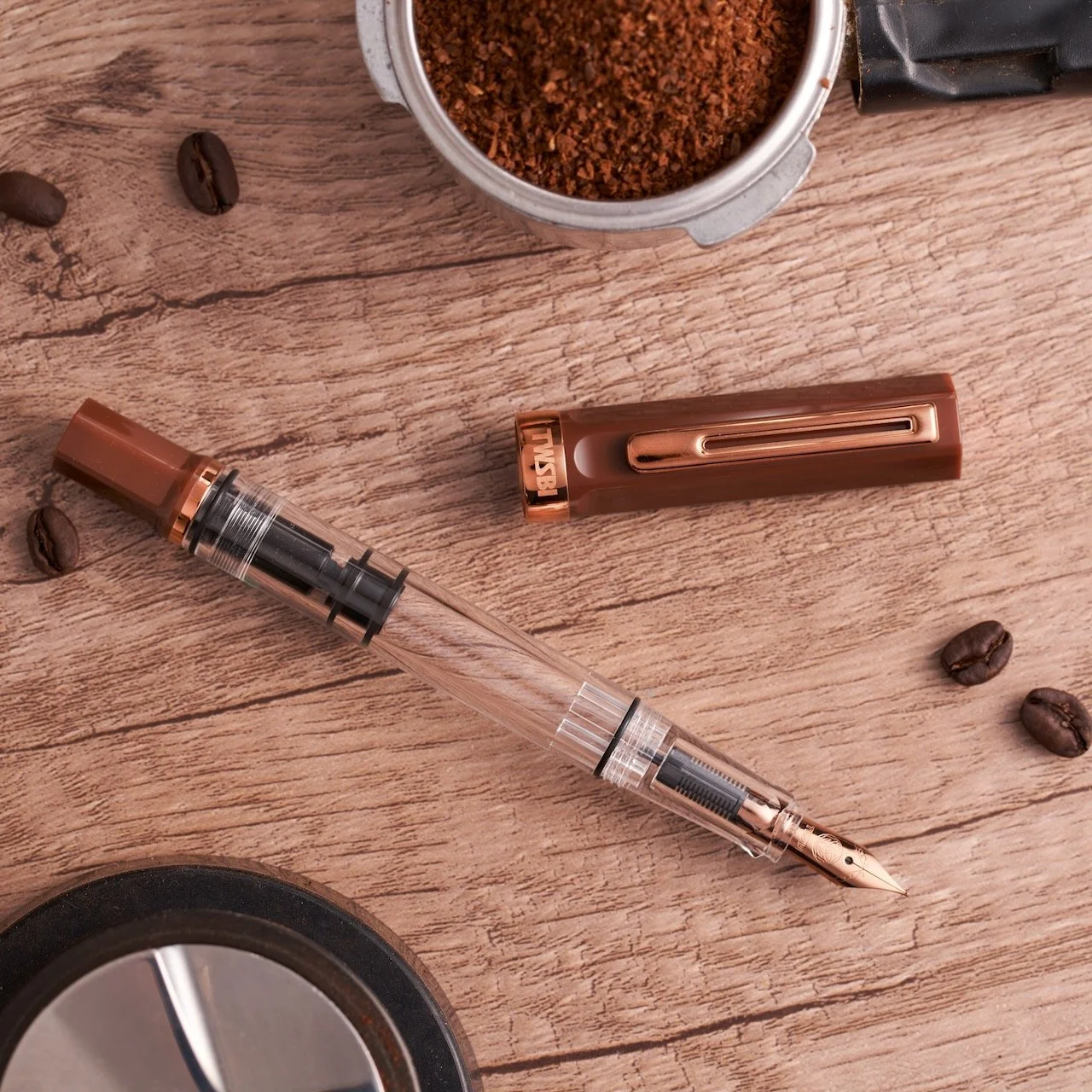 TWSBI Espresso Bronze ECO Fountain Pen with ground coffee