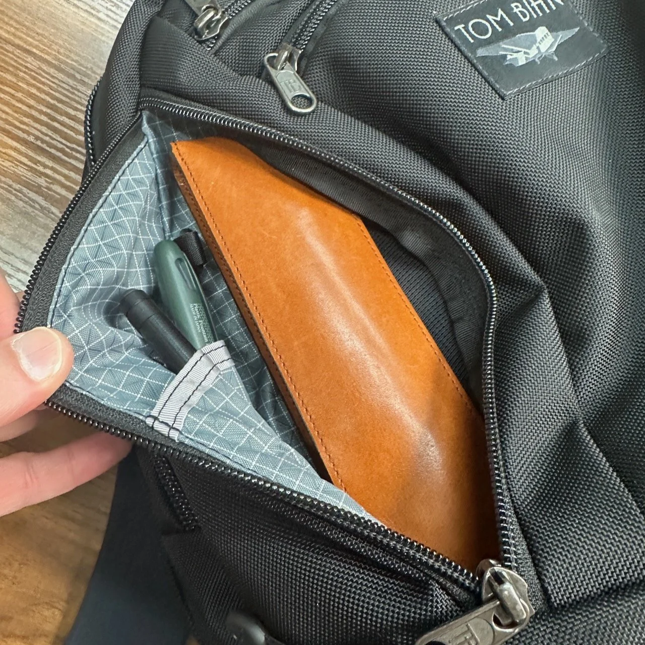 Stationery carry in the side pockets of the Tom Bihn Synapse 25
