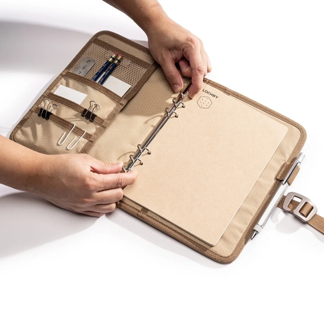 Field Binder A5 open with rings open and tan interior