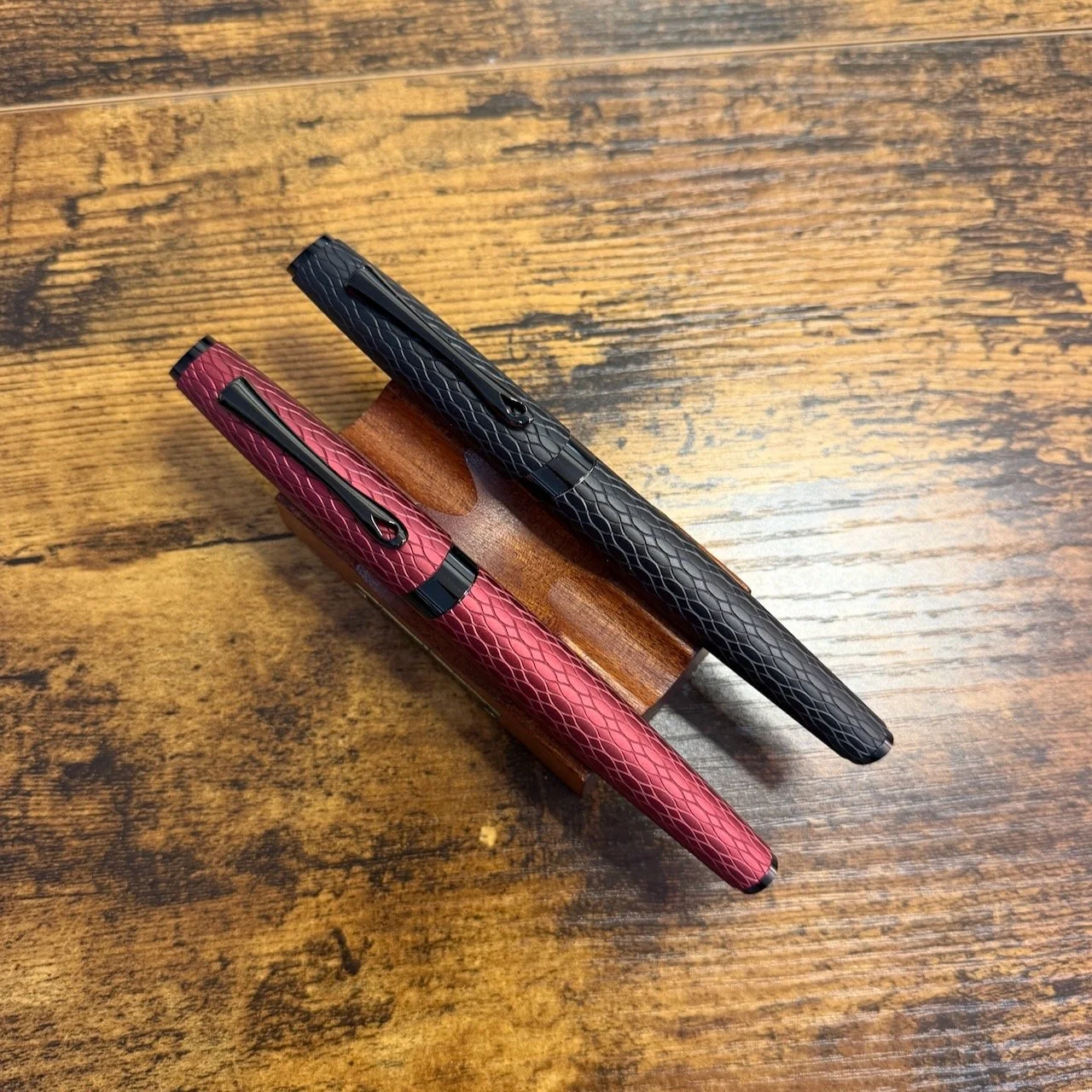 Diplomat Cobra Fountain Pen and Rollerball Side by Side in Bordeaux and Black Finishes