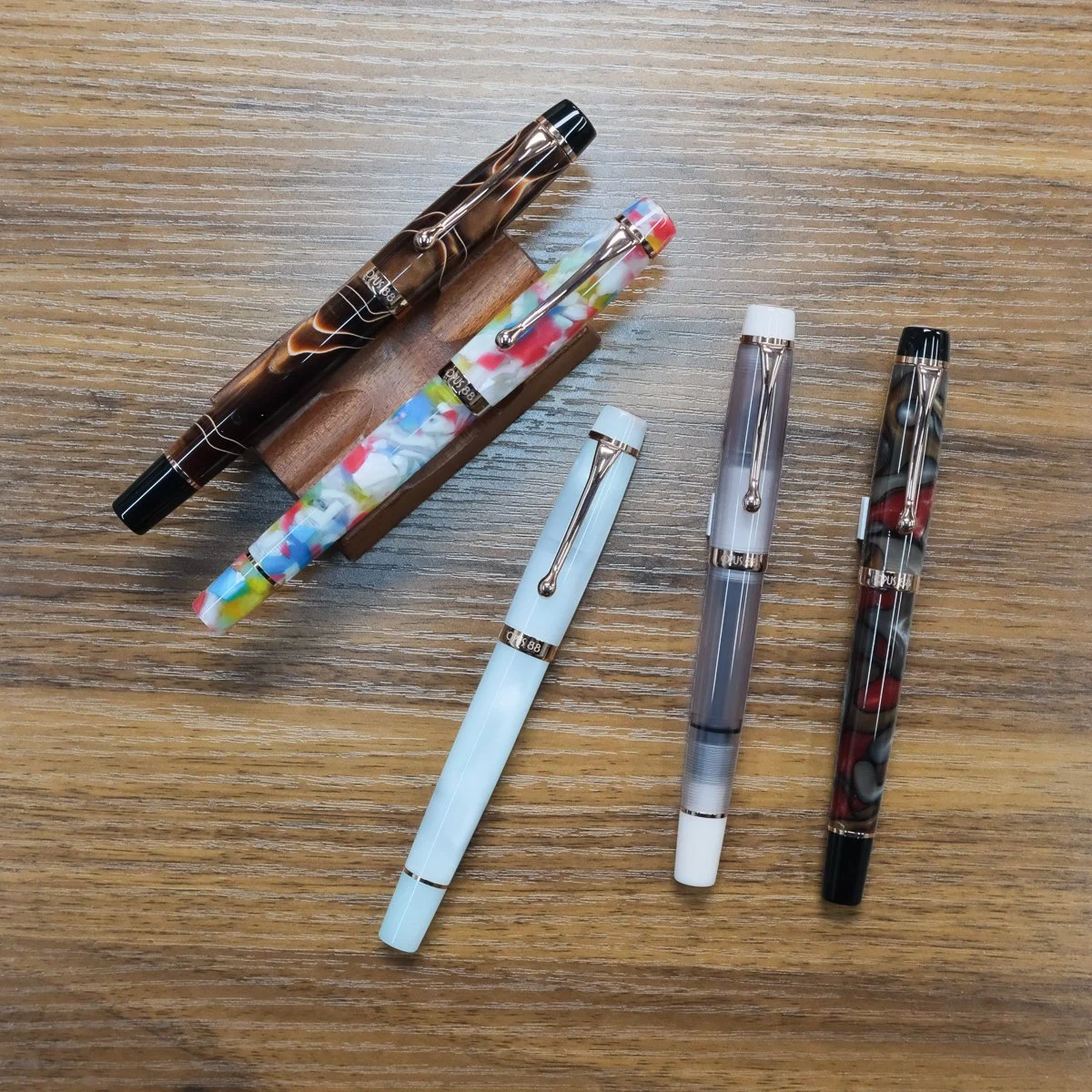 Opus 88 Harmony Fountain Pens arrayed on desk