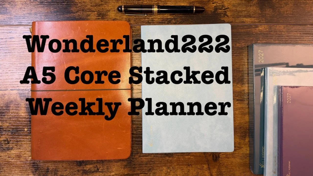Wonderland222 A5 Core Stacked Youtube preview showing planner on the desktop with a leather cover