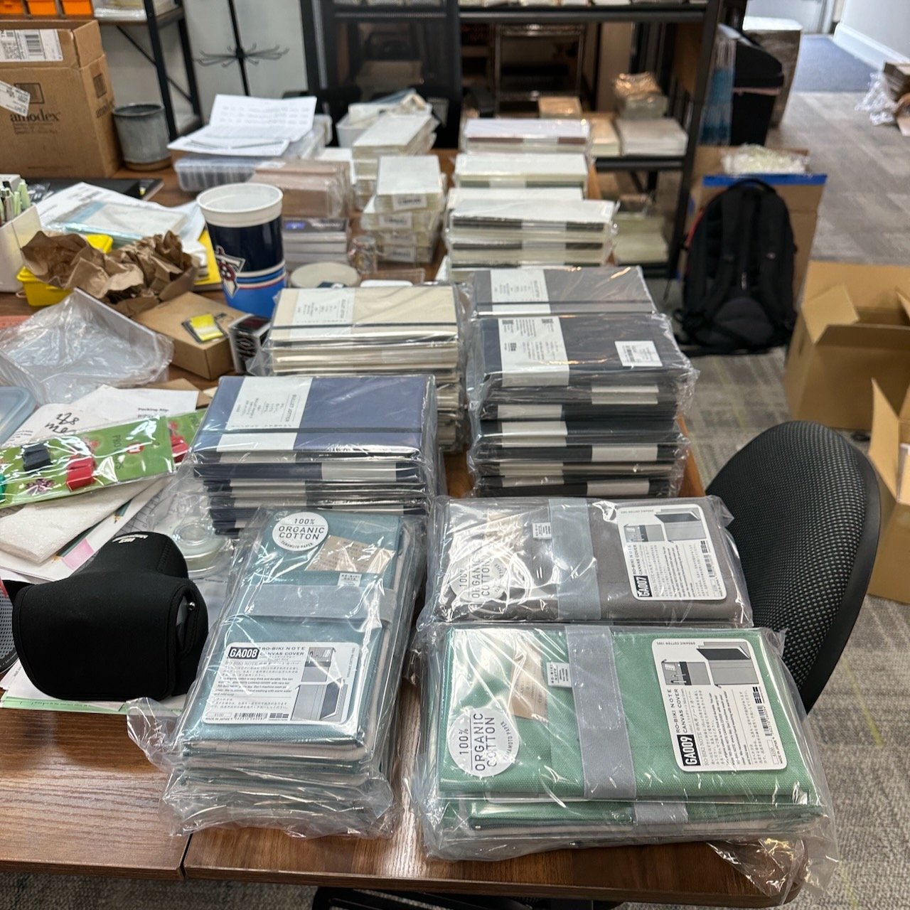 Yamamoto Ro-Biki Notebooks laid out on the table for pen show prep