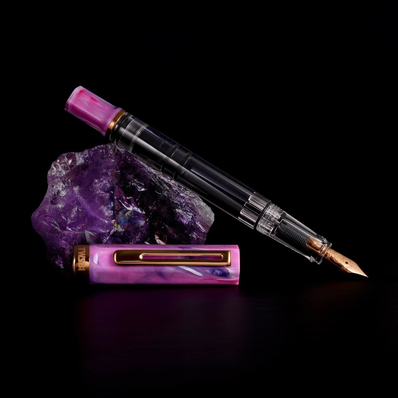 TWSBI ECO Fluorite Purple + Bronze Fountain Pen on a Black Background