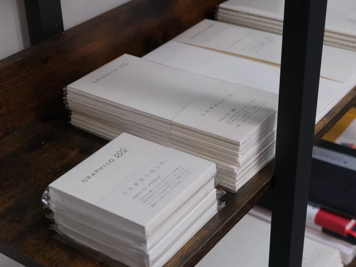 Graphilo Paper Stacked on the Shelf in the TGS Shop
