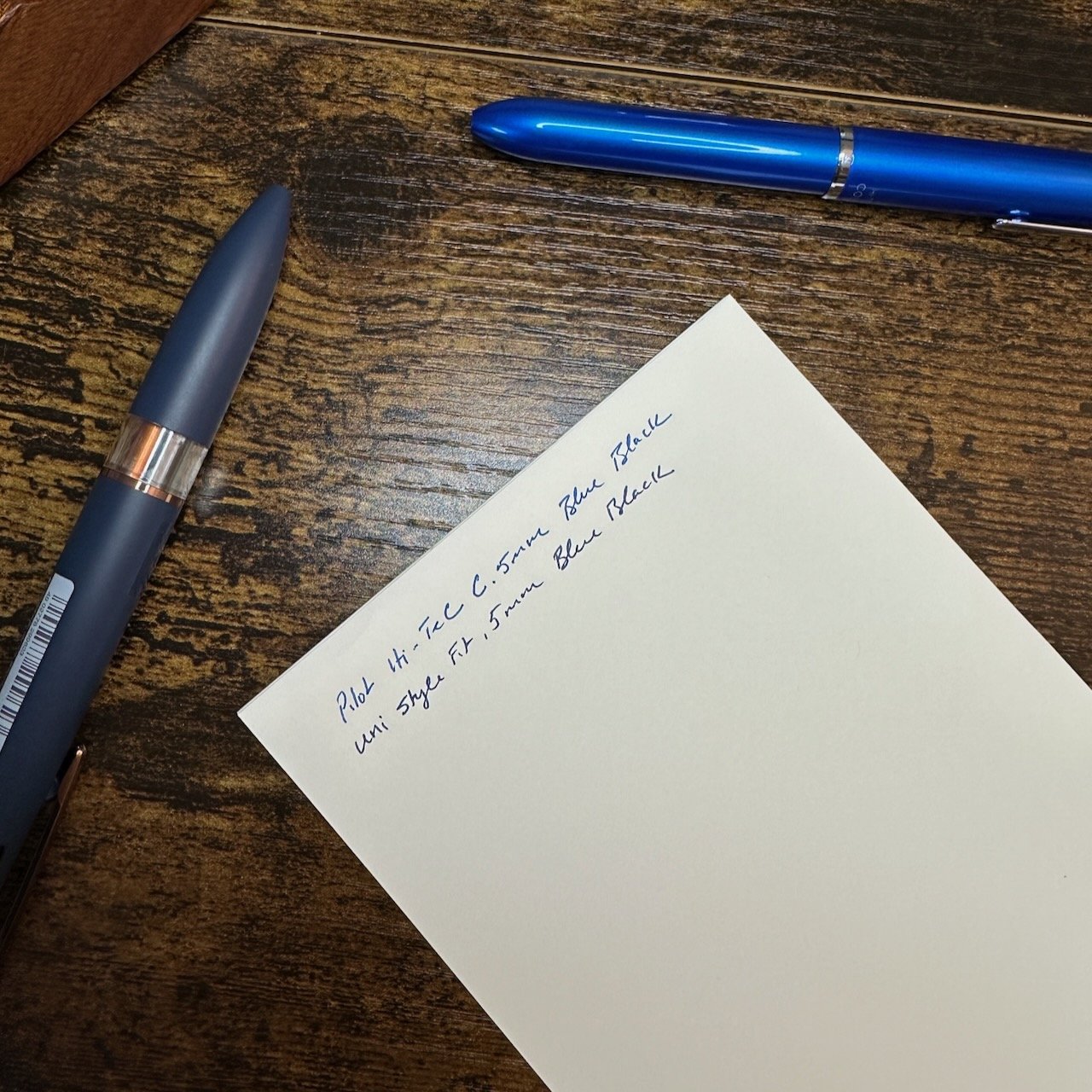 .5mm Writing Samples in Blue Black comparing Hi-Tec-C Coleto and Uni Style FIt