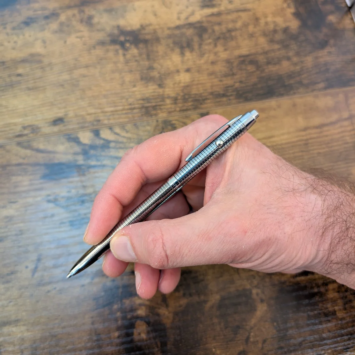Fisher Space Pen Shuttle Pen Grid in-hand