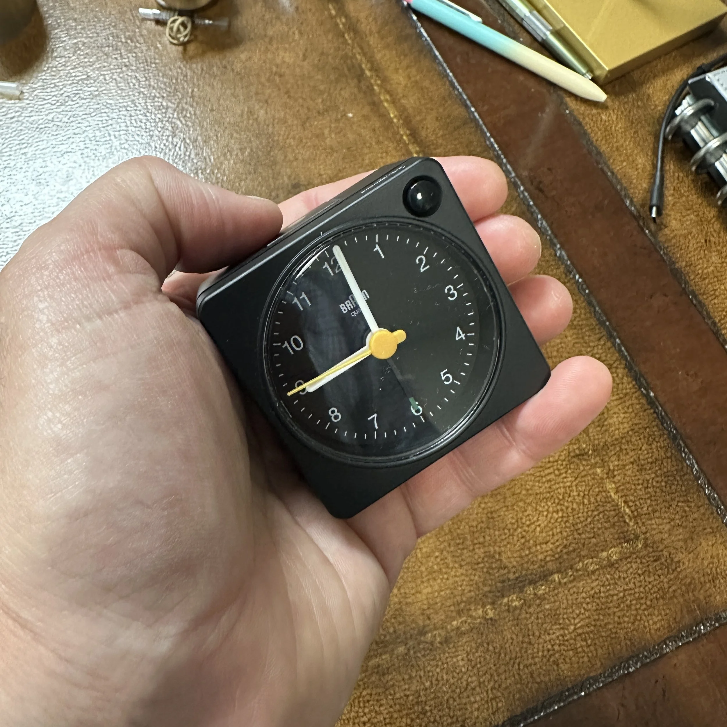 Braun Alarm Clock Scale Shot in Hand