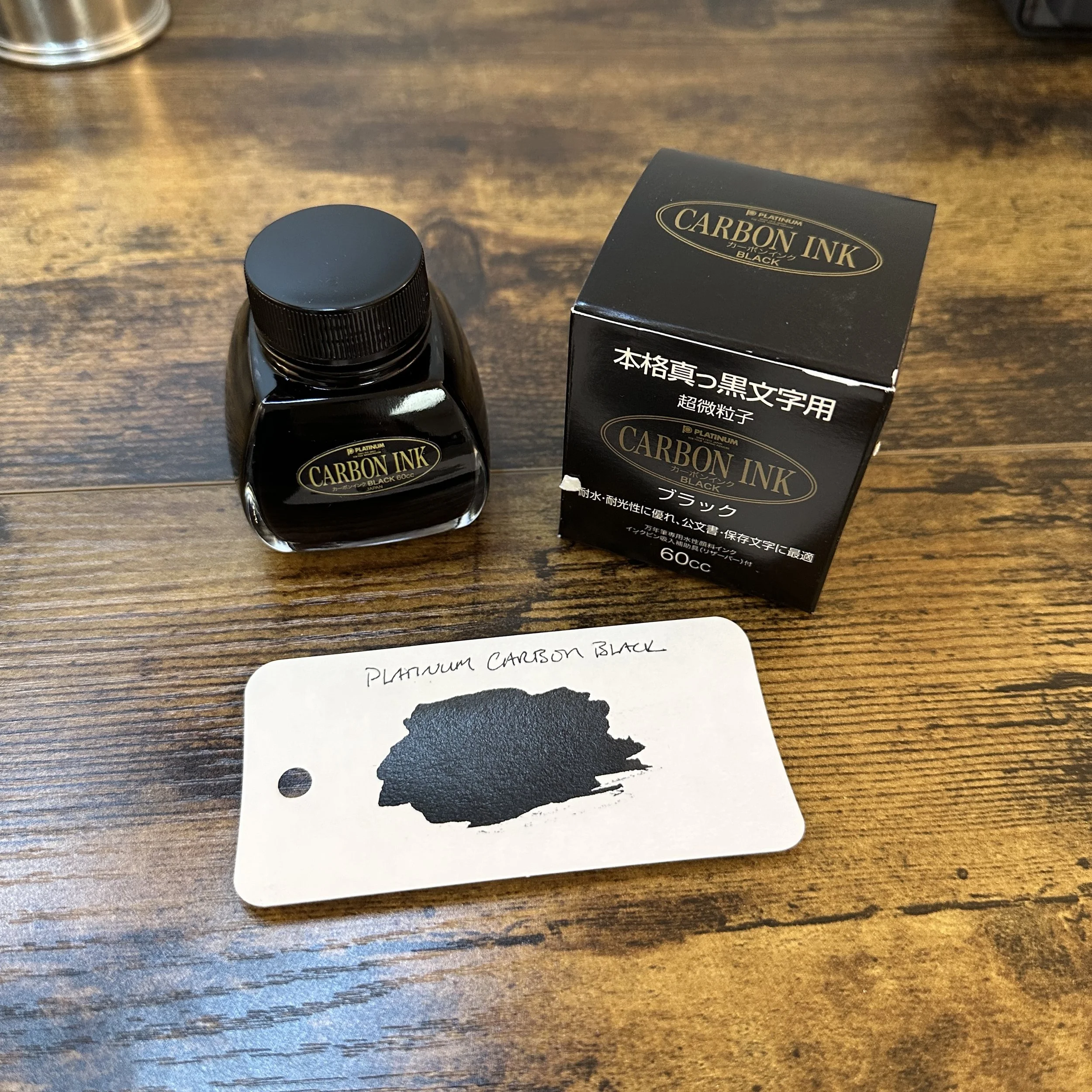 Platinum Carbon Black Bottle and Swatch
