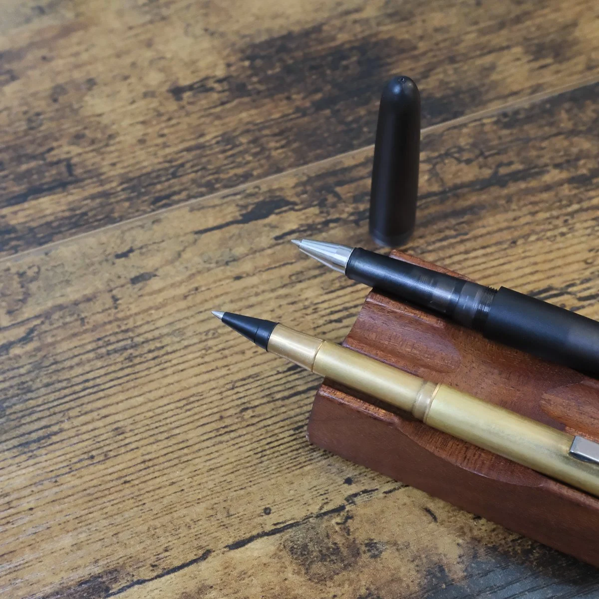Kakimori Frost and Traveler's Brass Inkball Pens Sitting Side by Side
