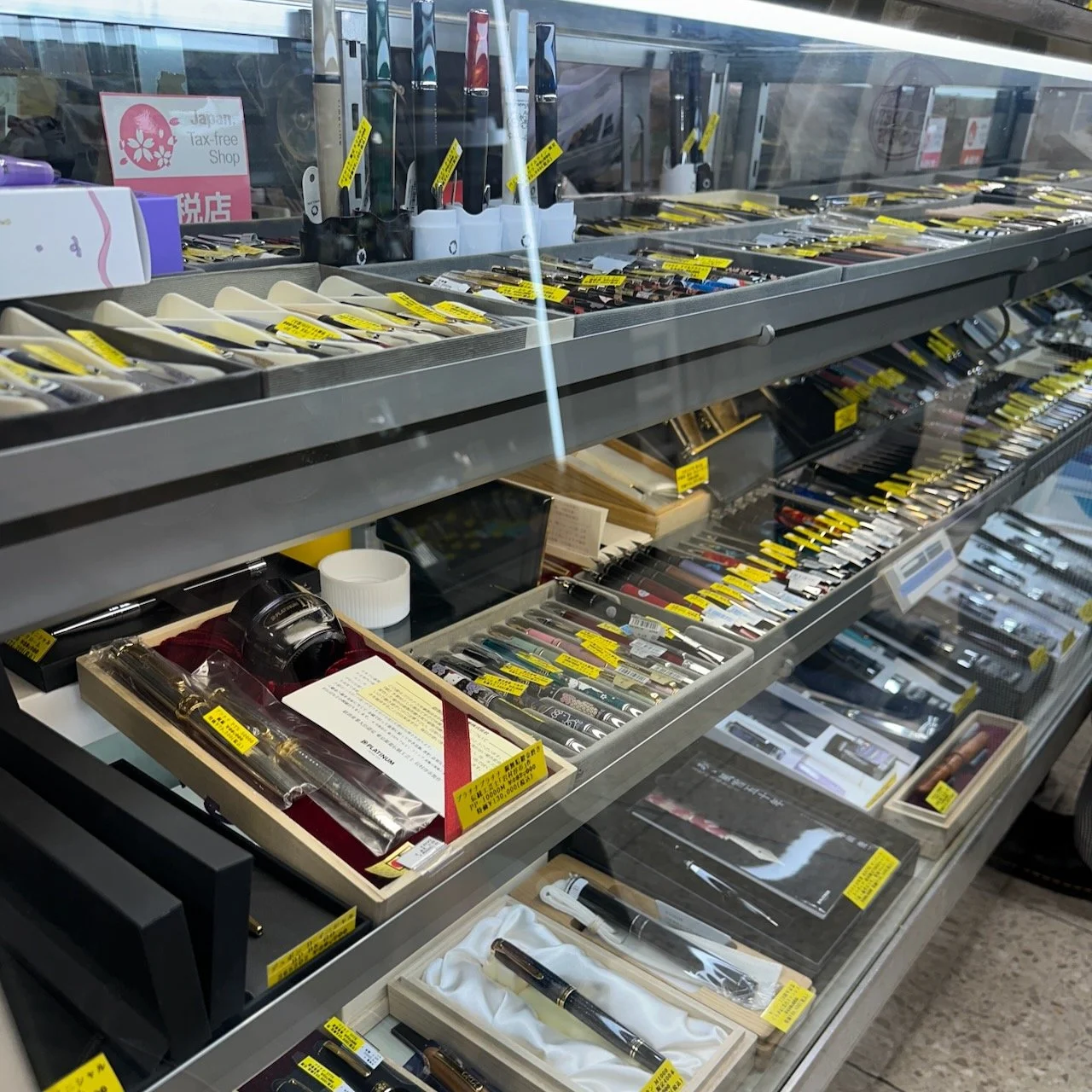 Selection of fountain pens in a market-stall window case