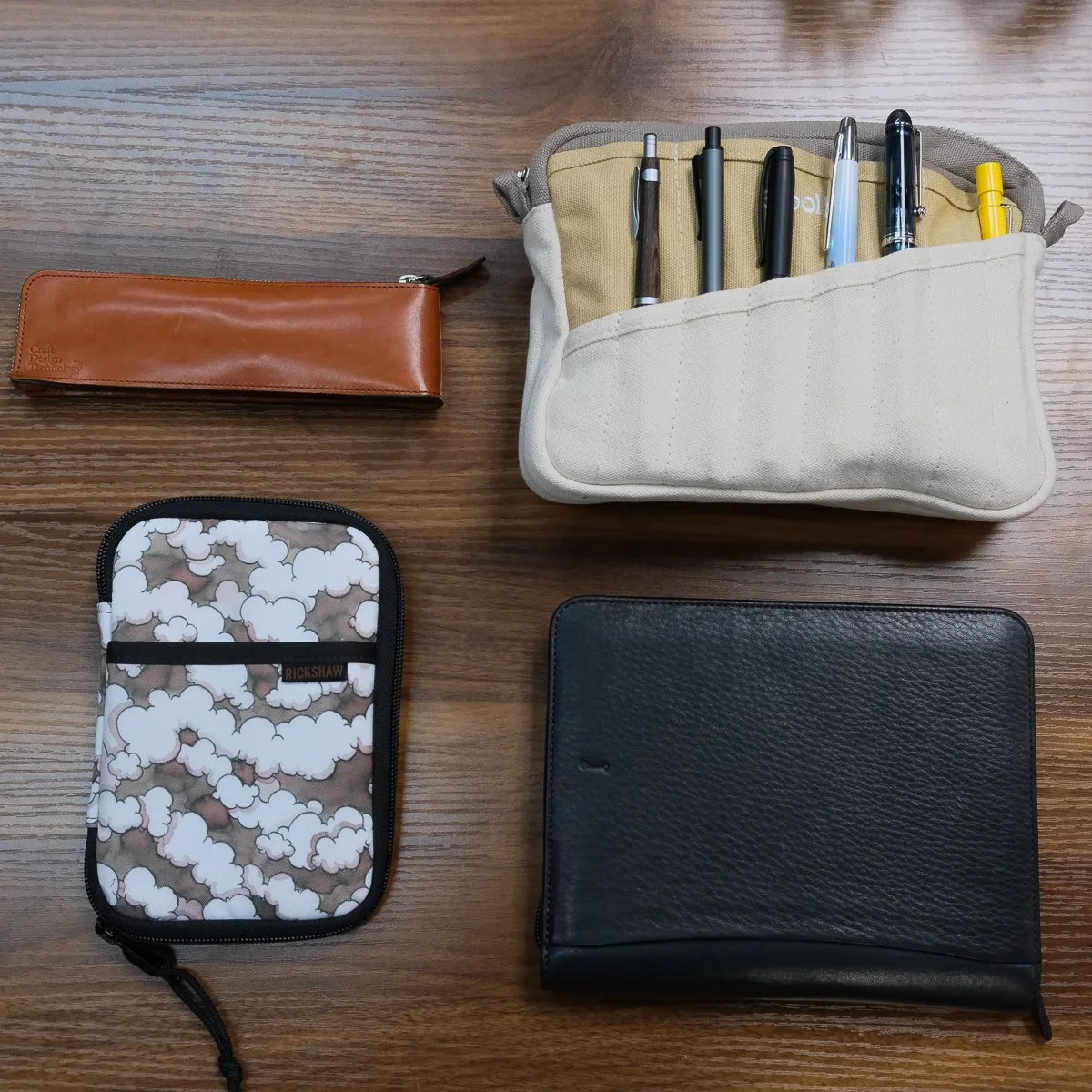 A mix of leather and fabric pen cases