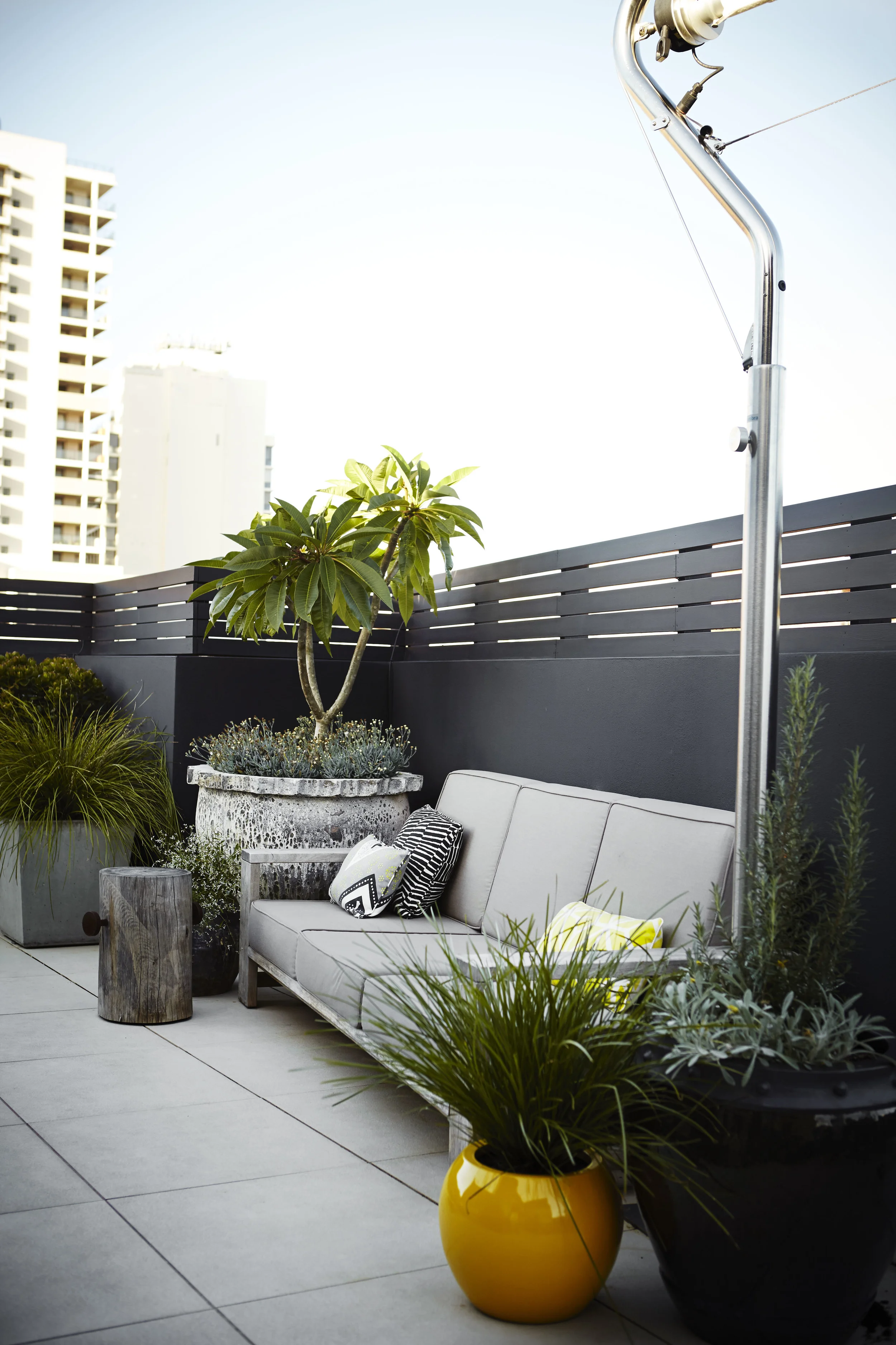 also from our Redfern Rooftop, an outdoor lounge retreat is made cosy and inviting with a feature pot, small tree and complimentary smaller items