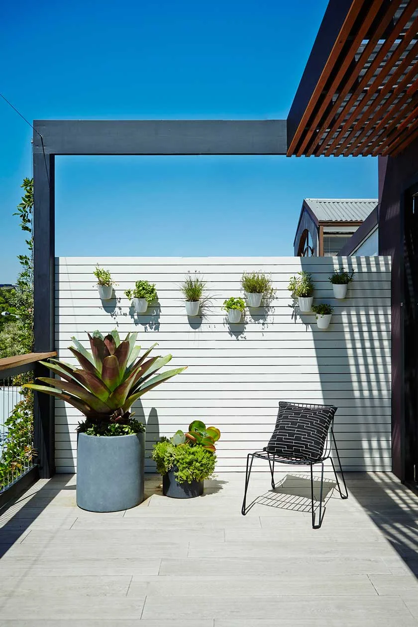 5. Add character with a garden wall and pot cluster of mixed planting