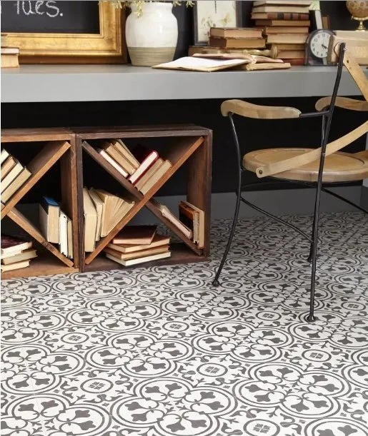 vinyl flooring with an intricate pattern installed under a reading nook bench